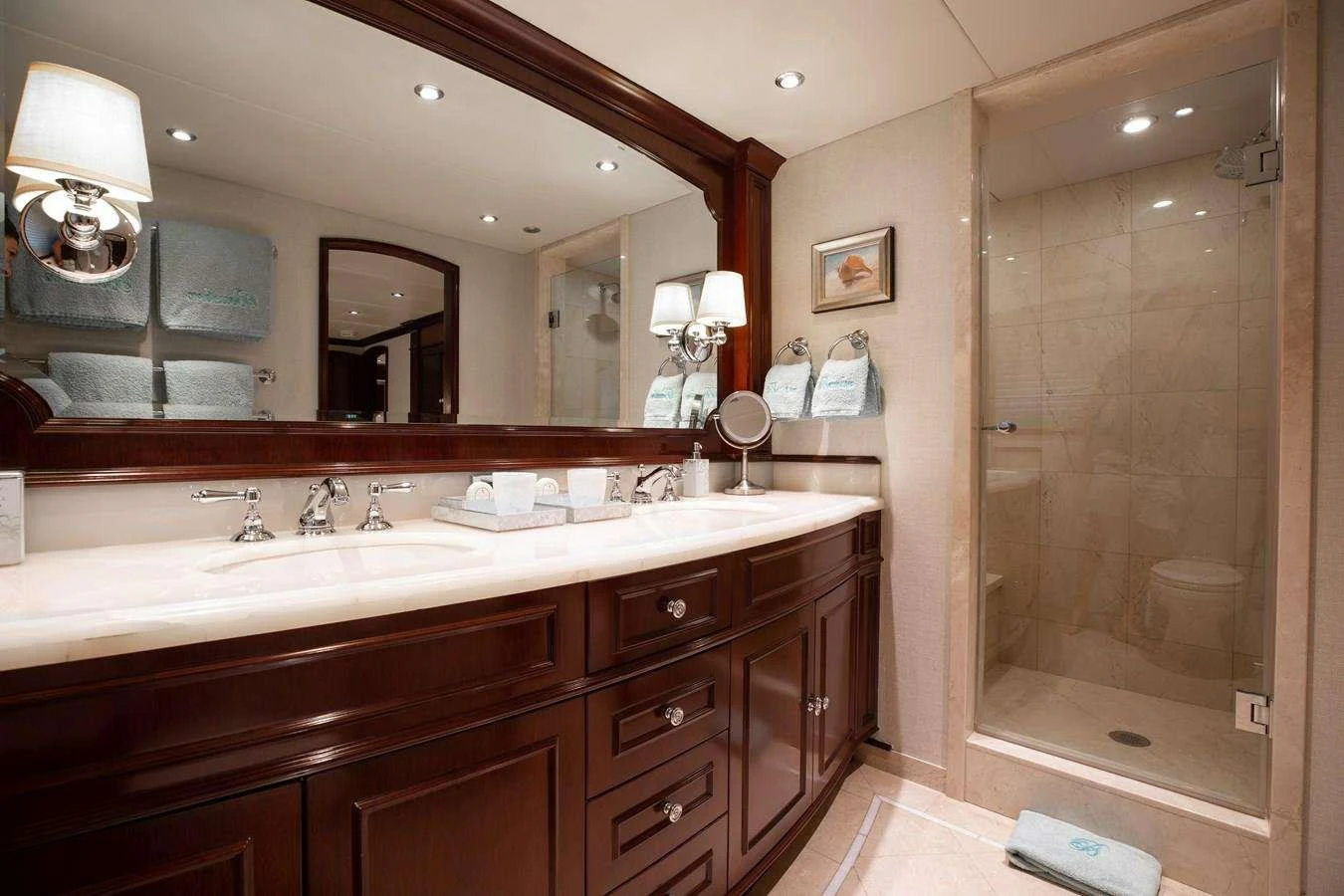 a bathroom with a large mirror aboard BOUCHON Yacht for Charter