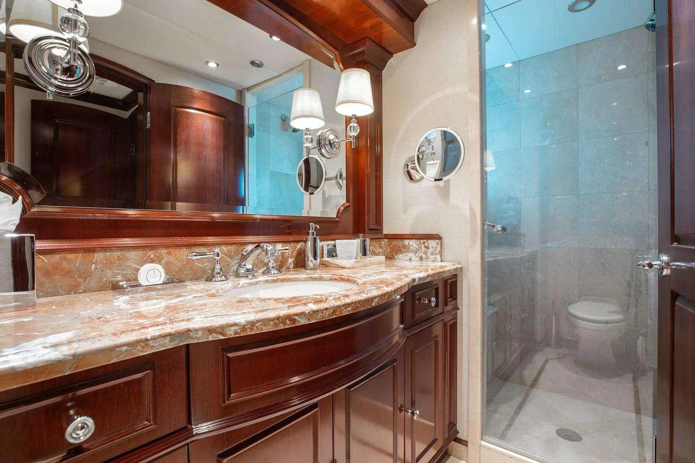 a bathroom with a large mirror aboard BOUCHON Yacht for Charter