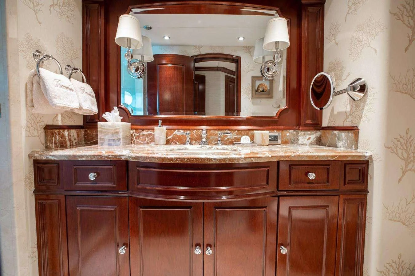 a bathroom with a large mirror aboard BOUCHON Yacht for Charter