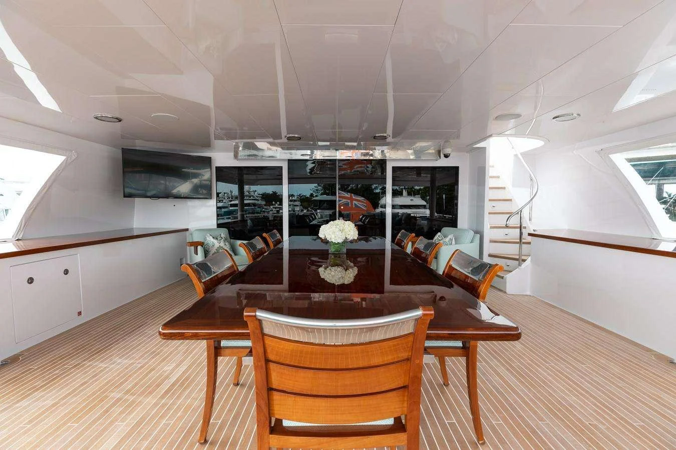 a room with a table and chairs aboard BOUCHON Yacht for Charter