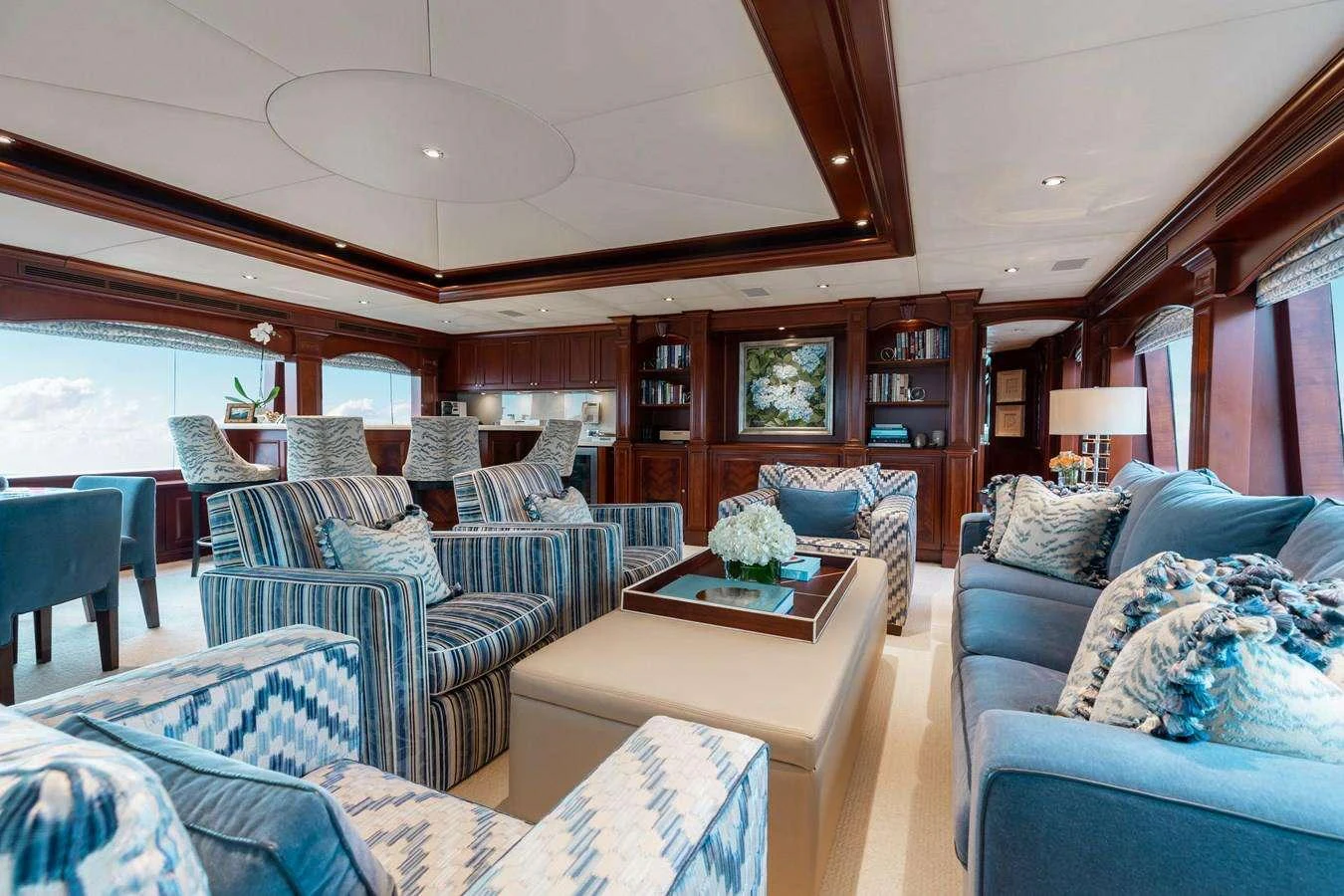 a living room with a large window aboard BOUCHON Yacht for Charter