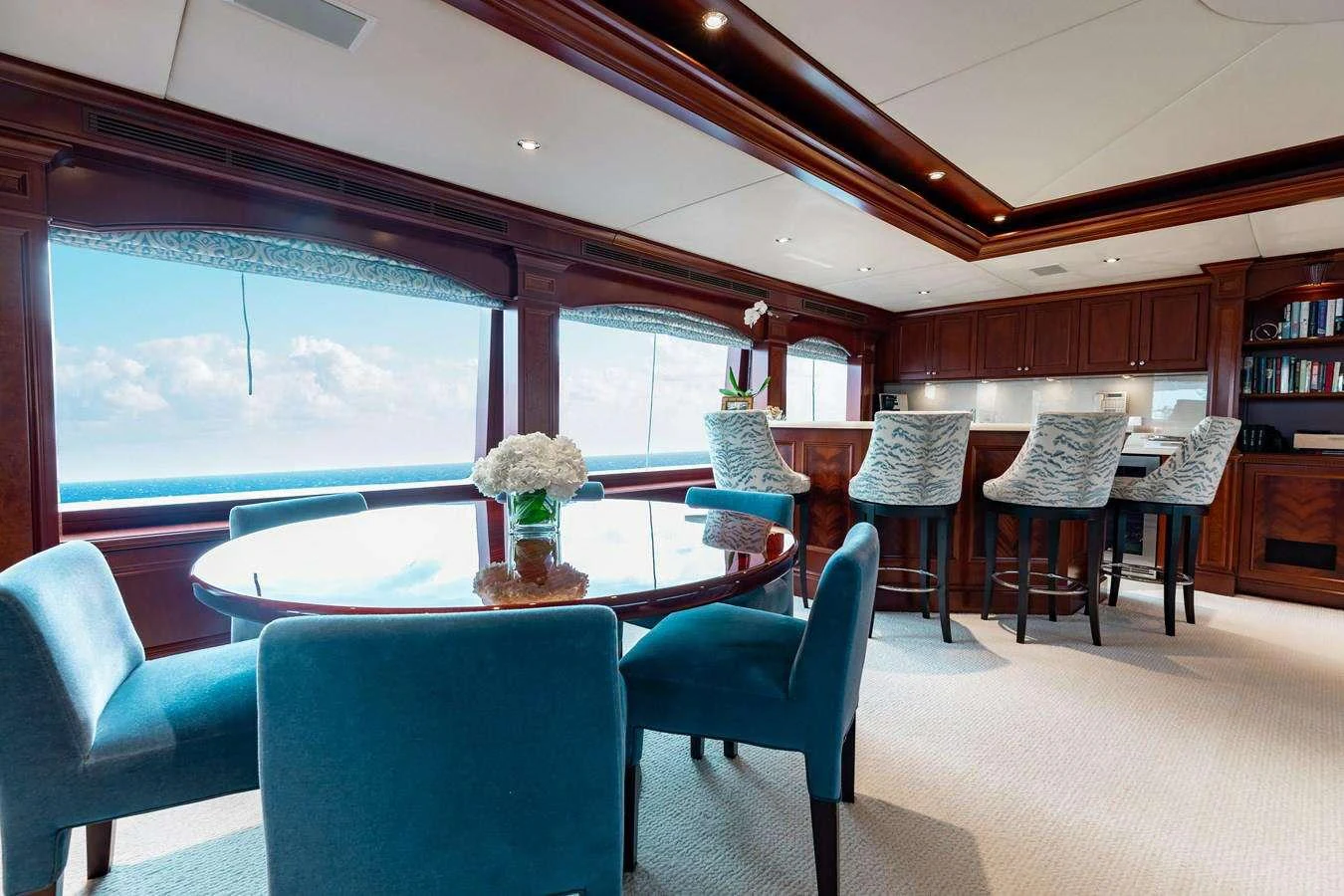 a room with a table and chairs aboard BOUCHON Yacht for Charter