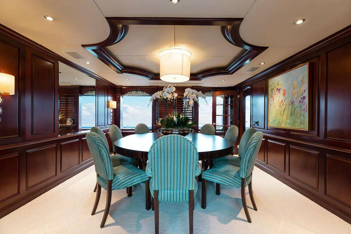 a dining room with a table and chairs aboard BOUCHON Yacht for Charter