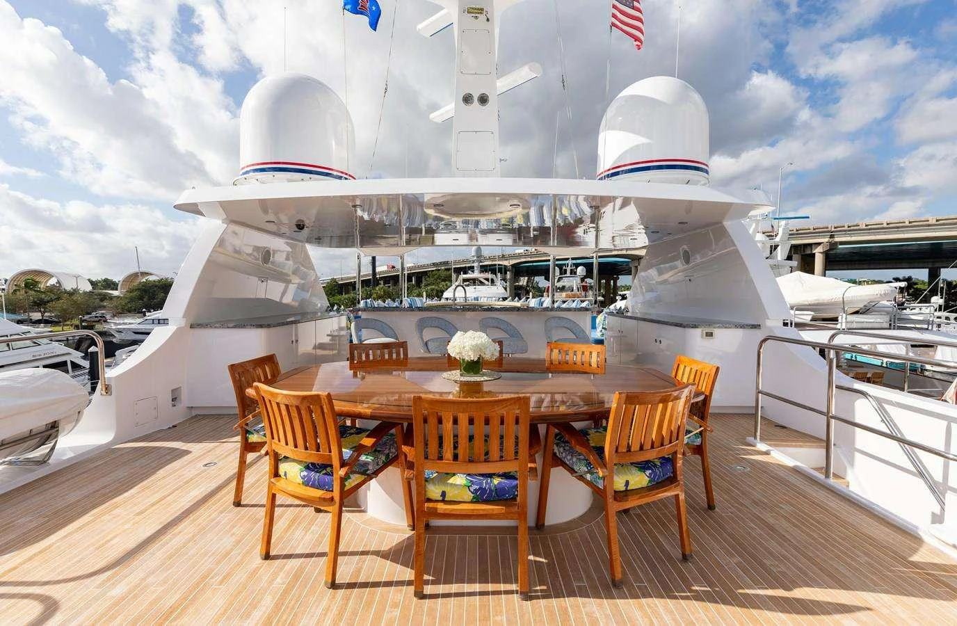 a table with chairs on it aboard BOUCHON Yacht for Charter