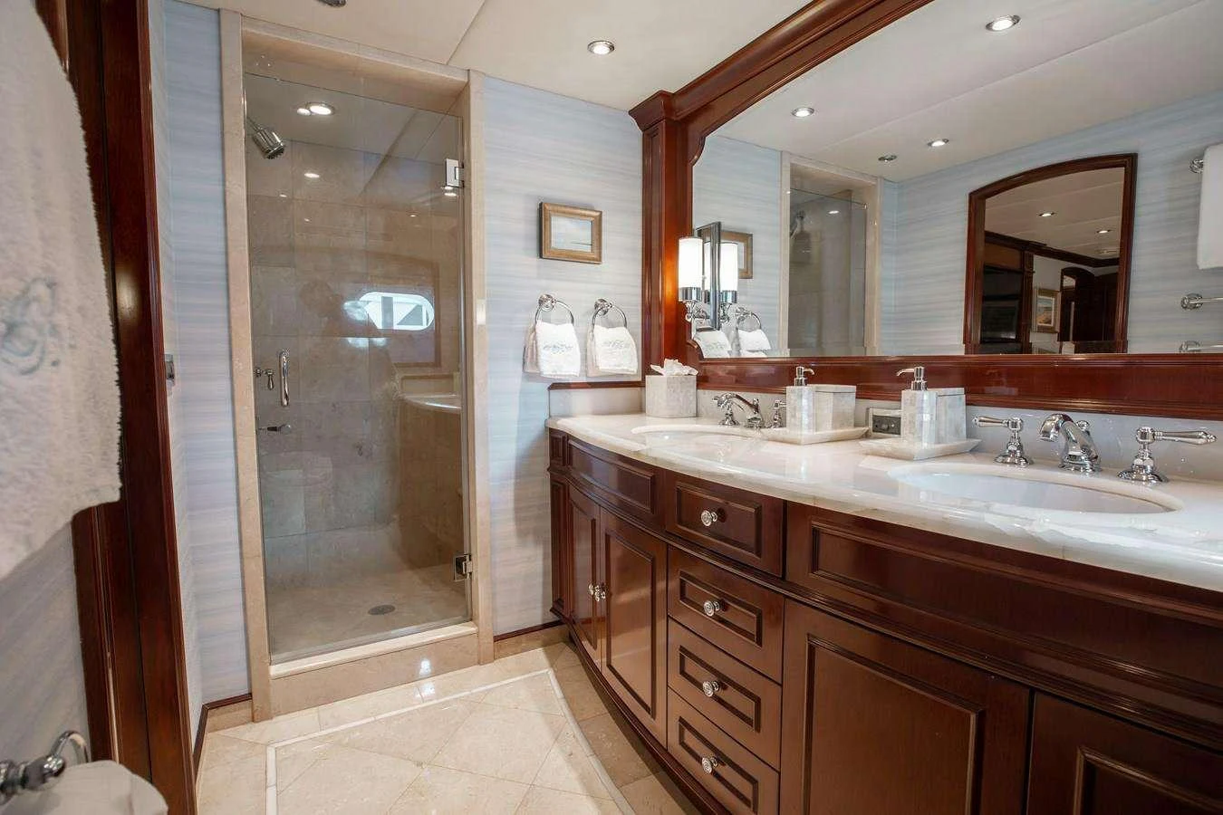 a bathroom with a large mirror aboard BOUCHON Yacht for Charter