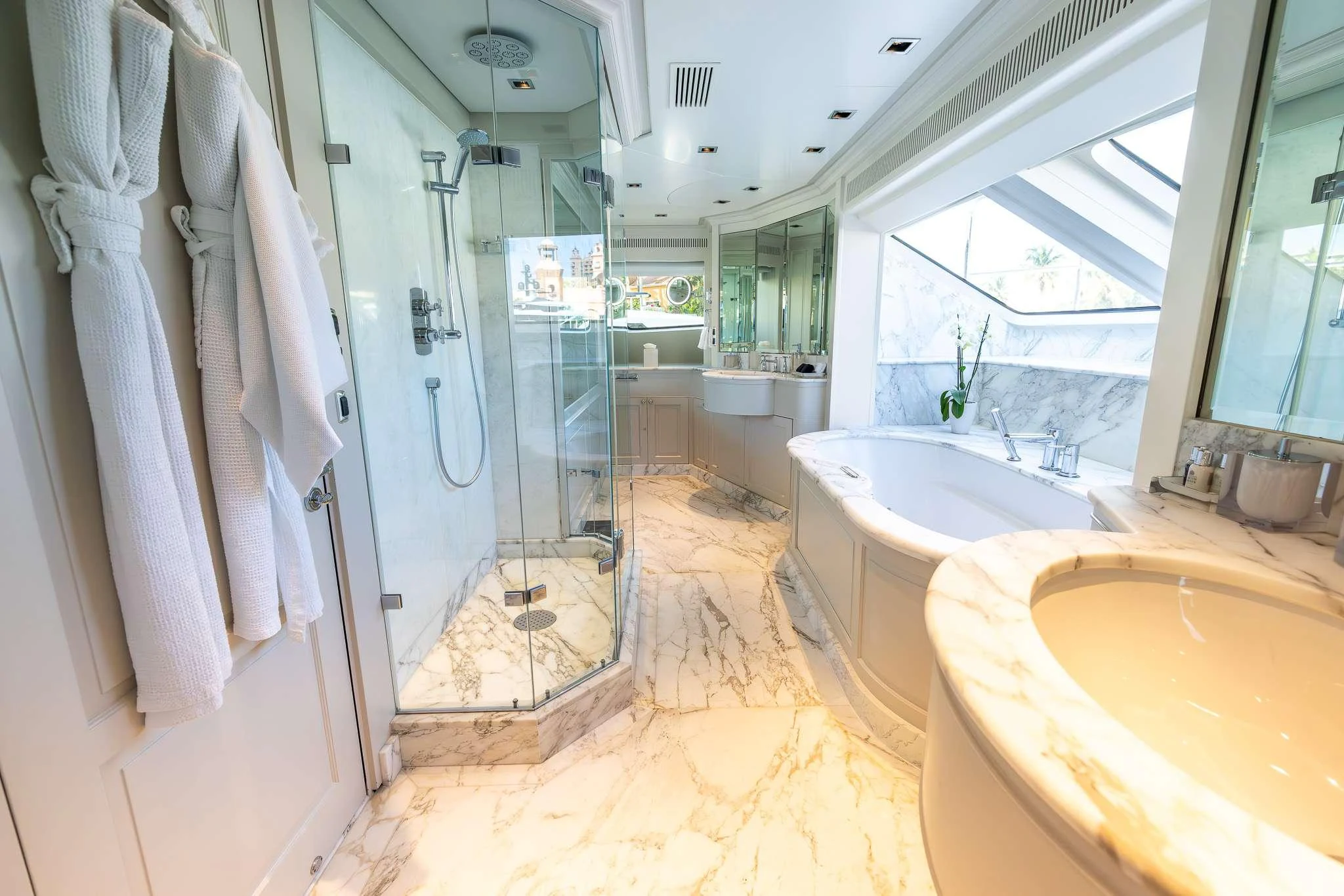 a bathroom with a tub sink and shower aboard ARTHUR'S WAY Yacht for Charter