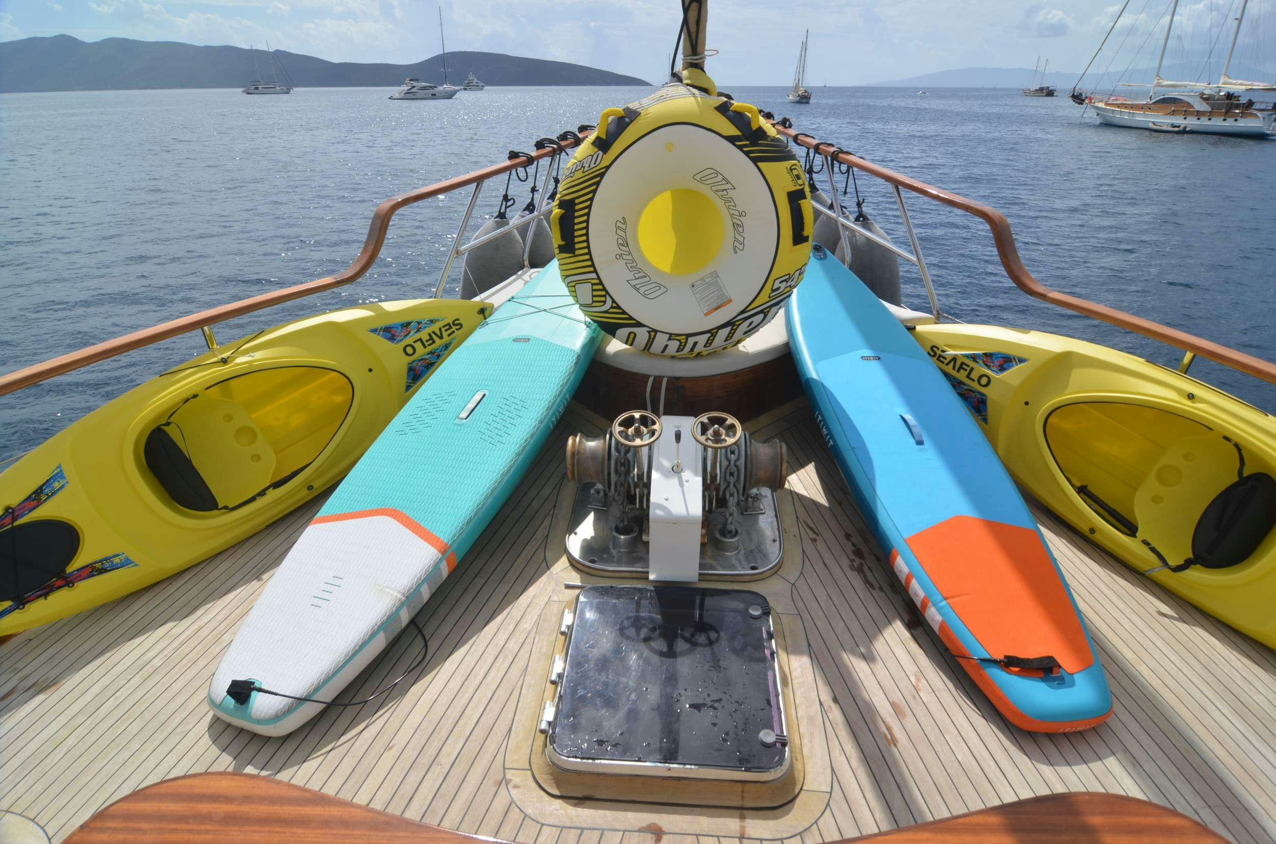 a yellow and blue boat on the water aboard 105 MOTOR Yacht for Charter