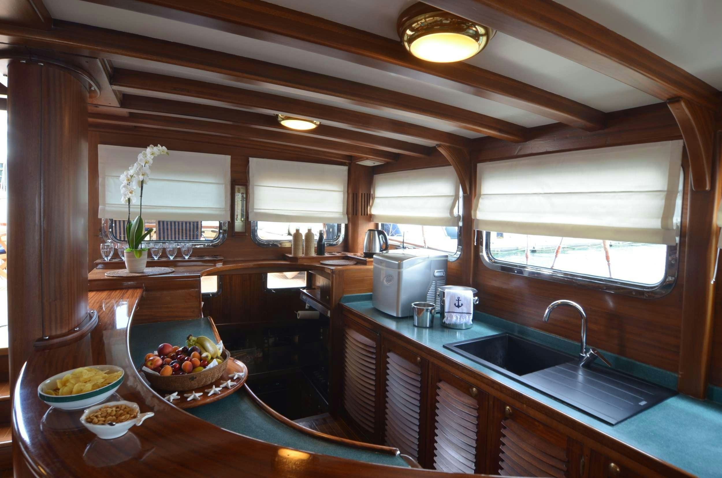 a kitchen with a large island aboard MAR E MAR Yacht for Charter
