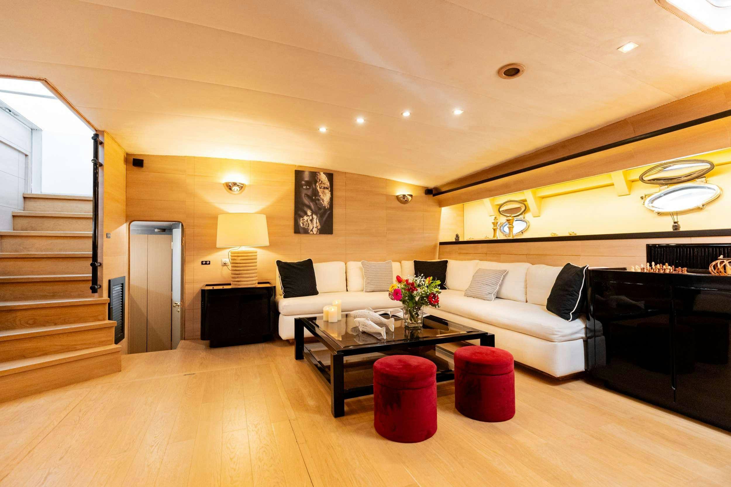 a living room with a wood floor aboard ELEGANT Yacht for Charter