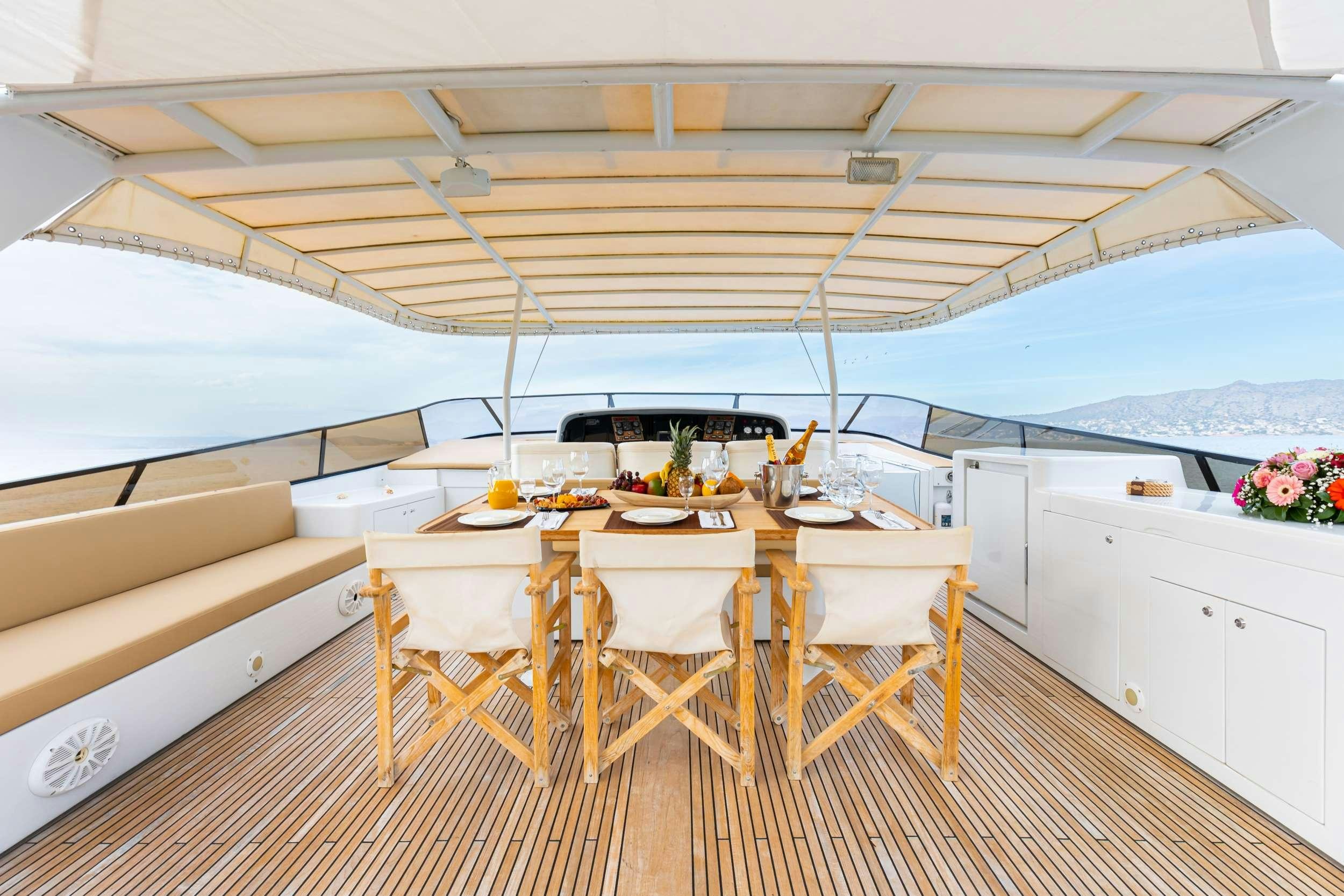 a table set for a meal aboard ELEGANT Yacht for Charter