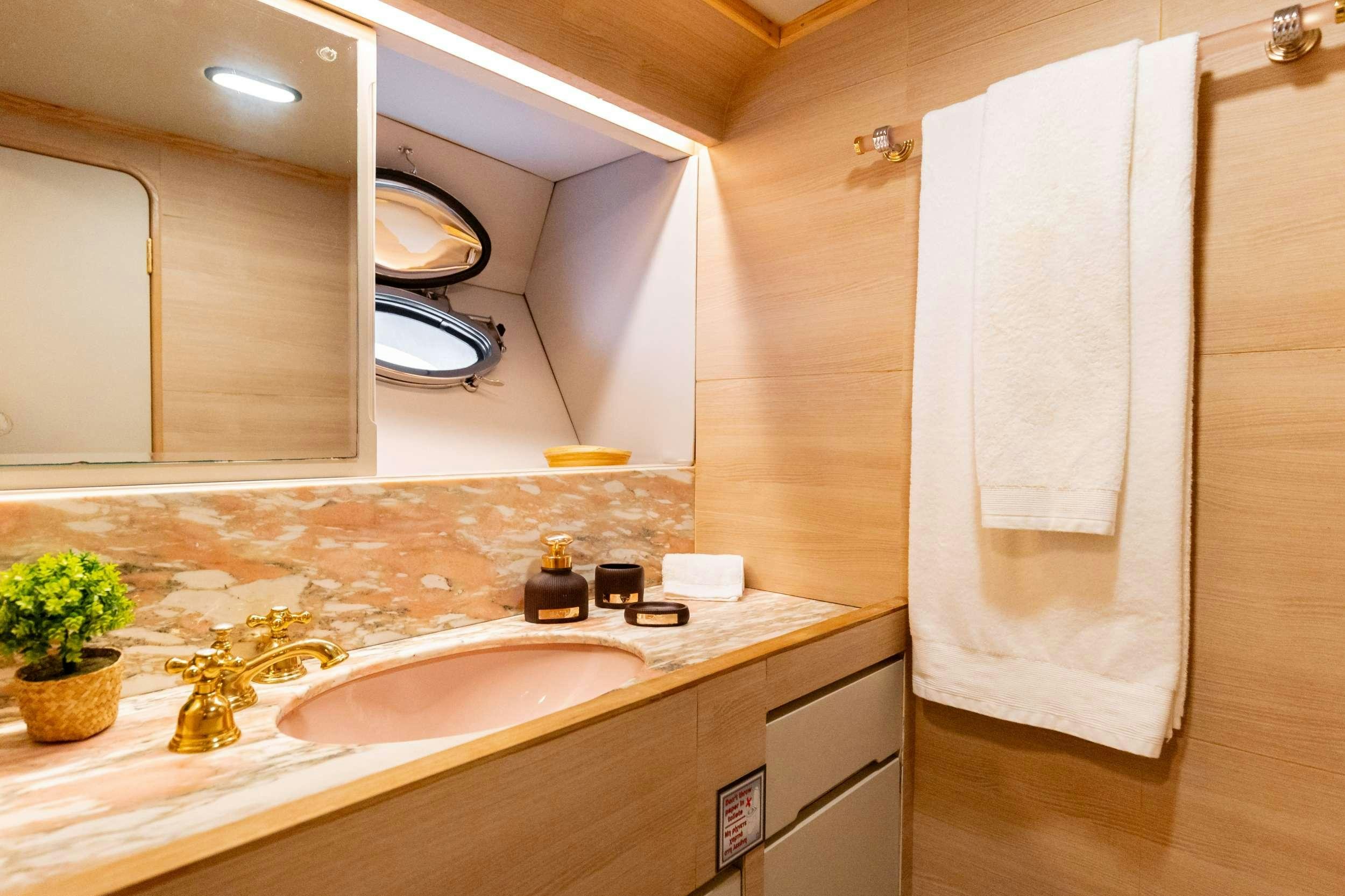 a bathroom with a sink and a toilet aboard ELEGANT Yacht for Charter