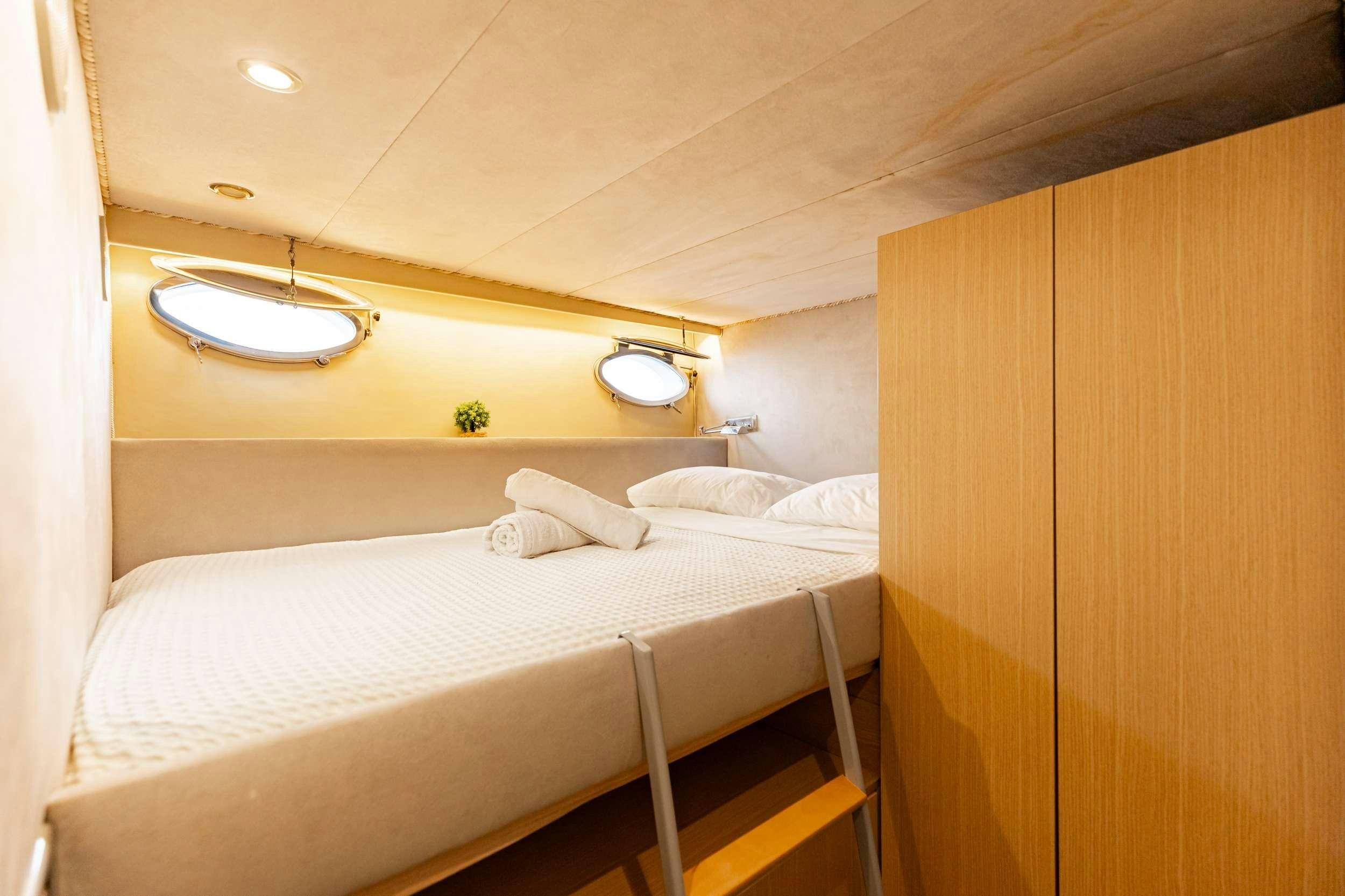 a bed with white sheets aboard ELEGANT Yacht for Charter
