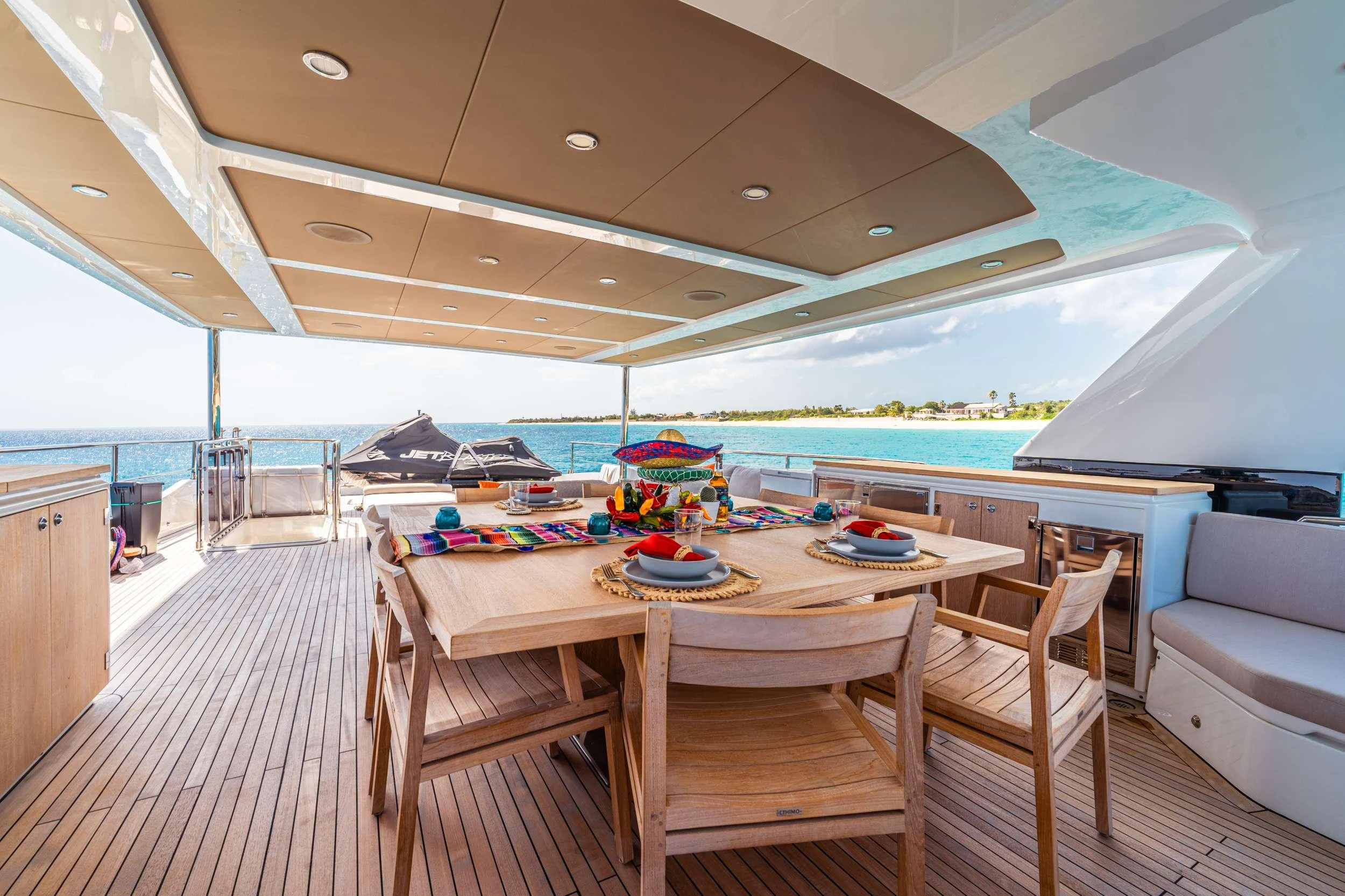 a large tent with a table and chairs aboard EXIT STRATEGY Yacht for Charter