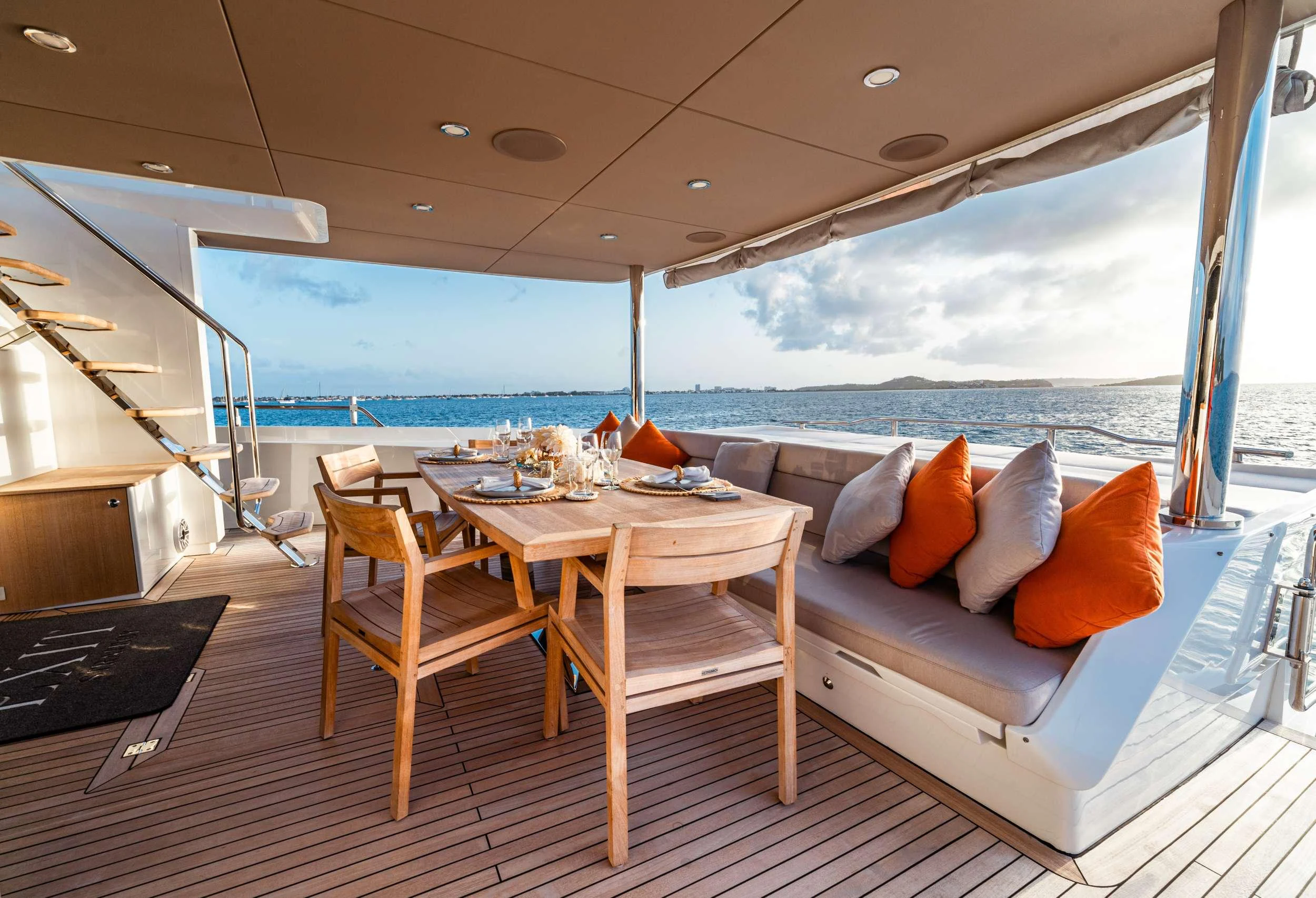 a room with a couch and a table and chairs aboard EXIT STRATEGY Yacht for Charter