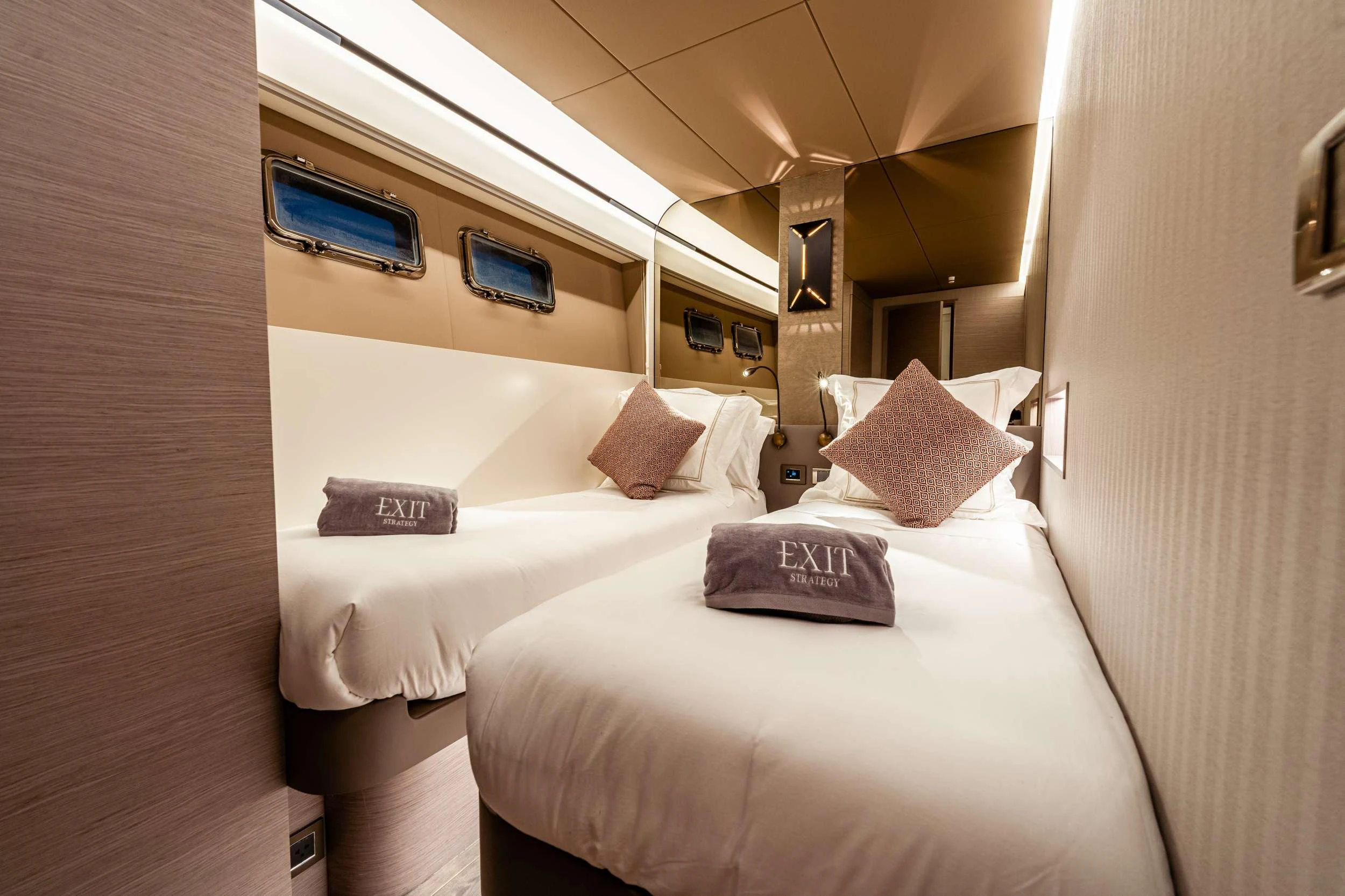 a room with two beds aboard EXIT STRATEGY Yacht for Charter