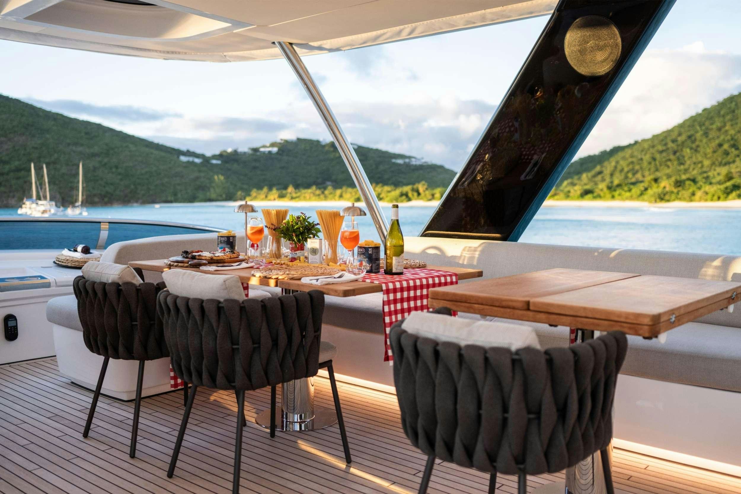 a table set for a meal on a boat aboard SIETE MARES Yacht for Charter