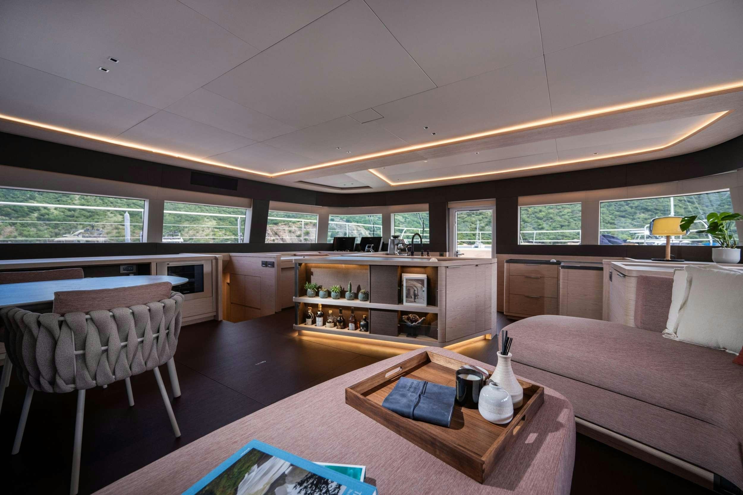 a living room with a couch and a table aboard SIETE MARES Yacht for Charter