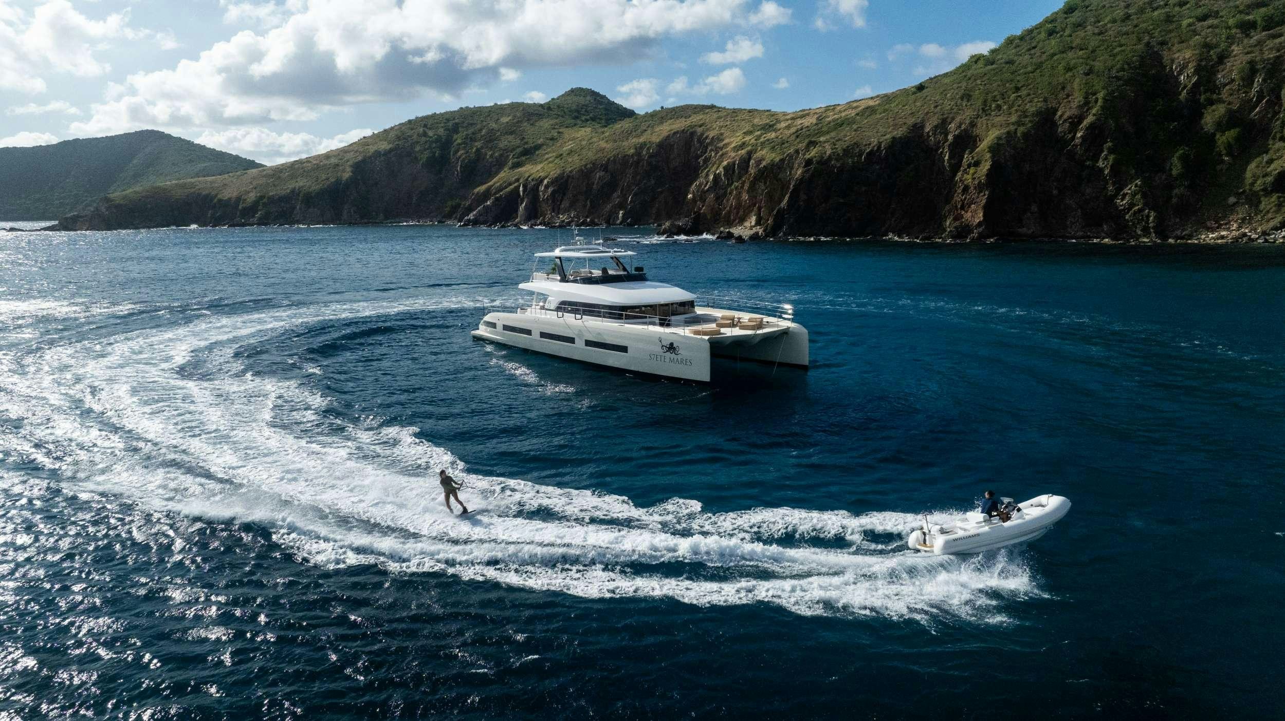 a person jumping out of the water aboard SIETE MARES Yacht for Charter