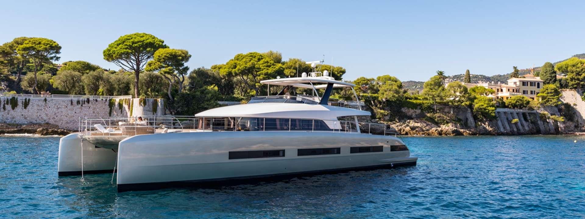a large white boat on the water aboard SIETE MARES Yacht for Charter