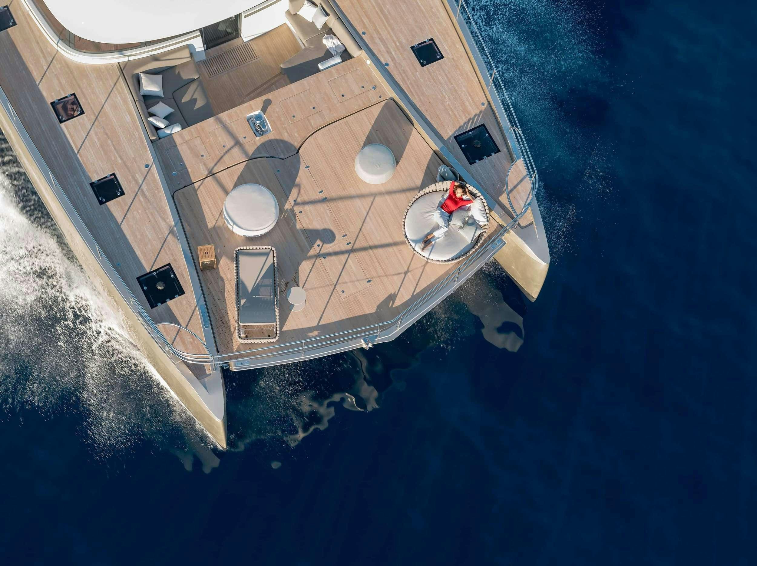 a circular island with a group of people in it aboard SIETE MARES Yacht for Charter