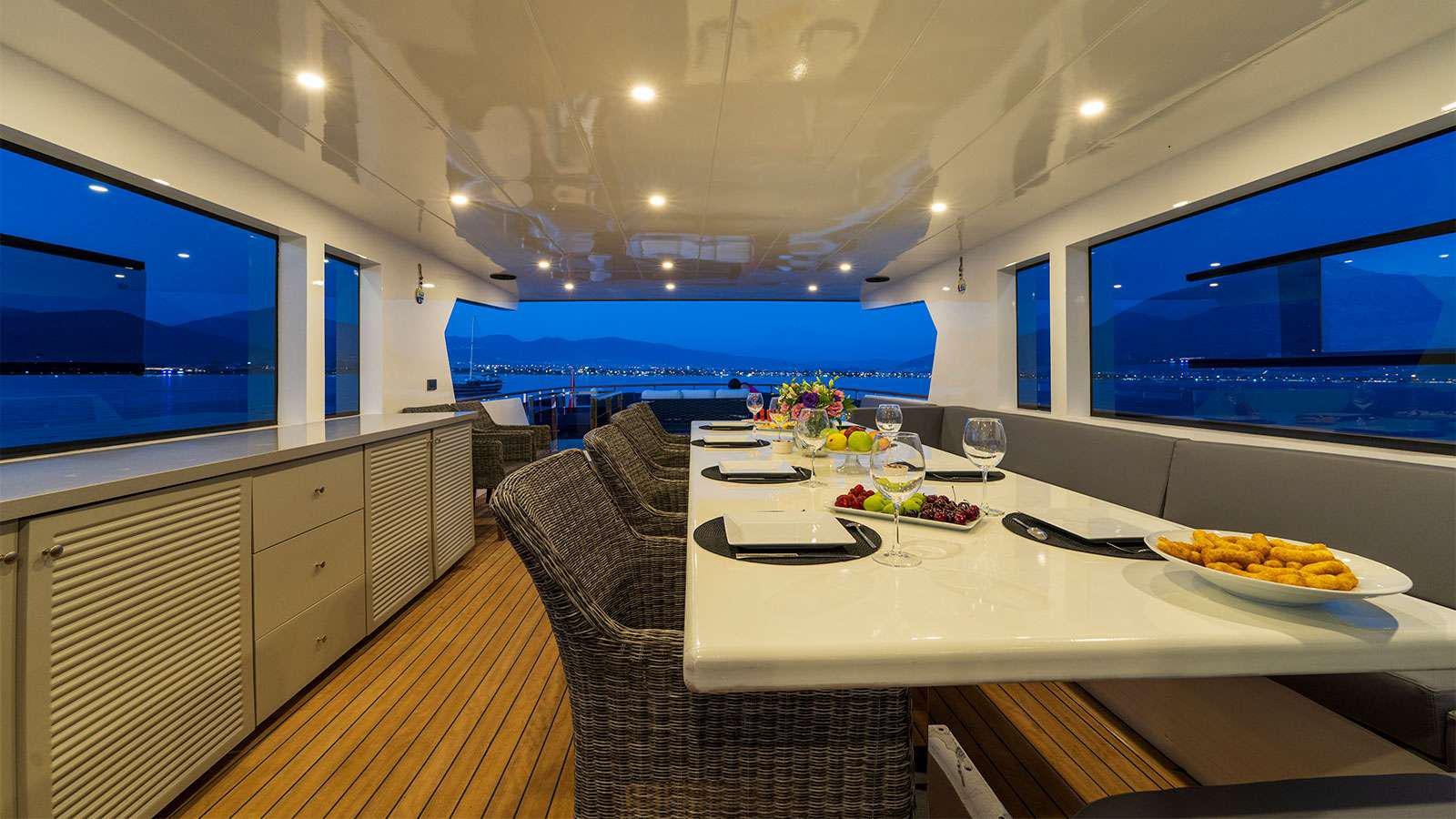 a dining table in a room aboard ALBATROS K Yacht for Charter