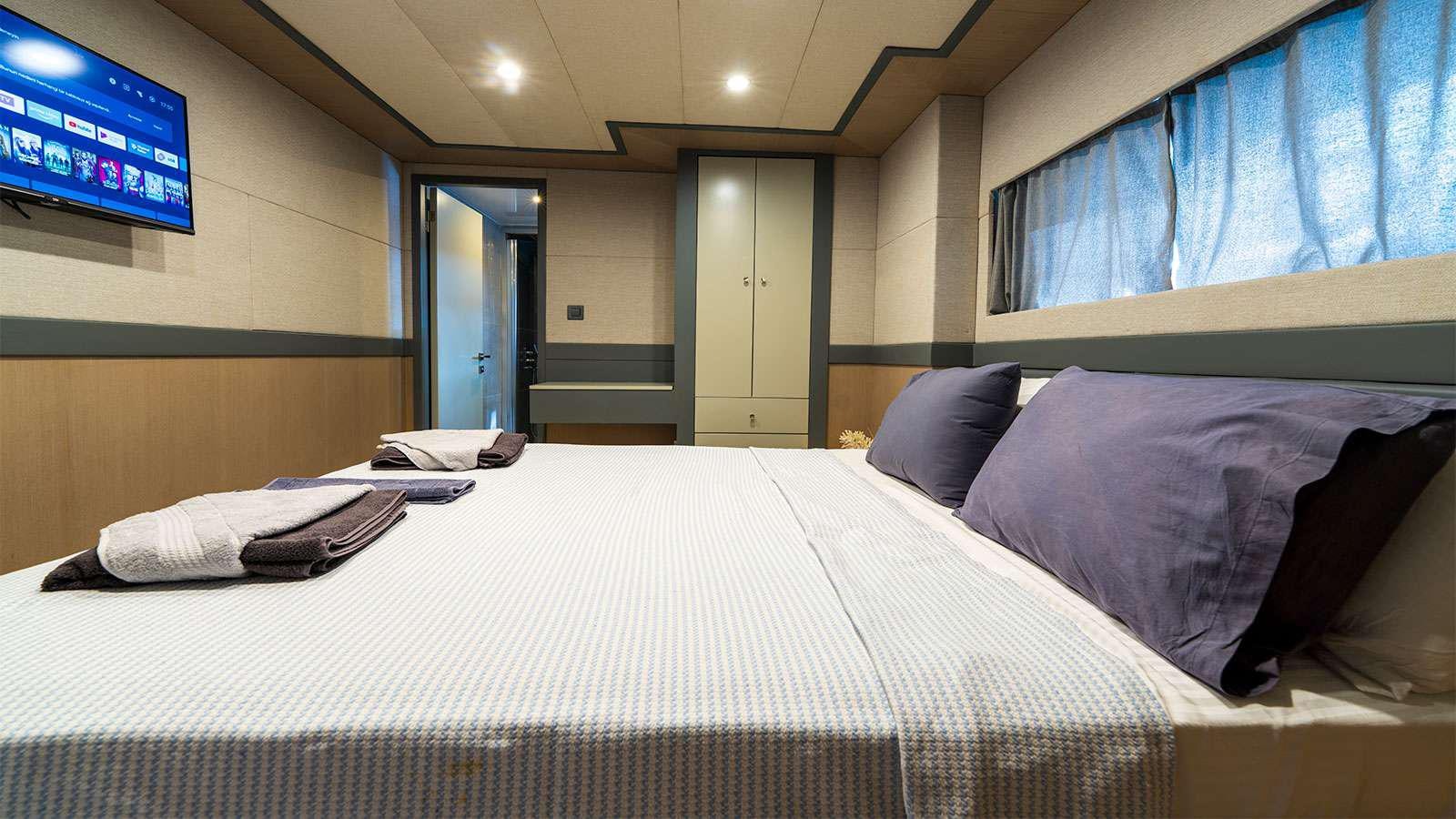 a bed in a room aboard ALBATROS K Yacht for Charter