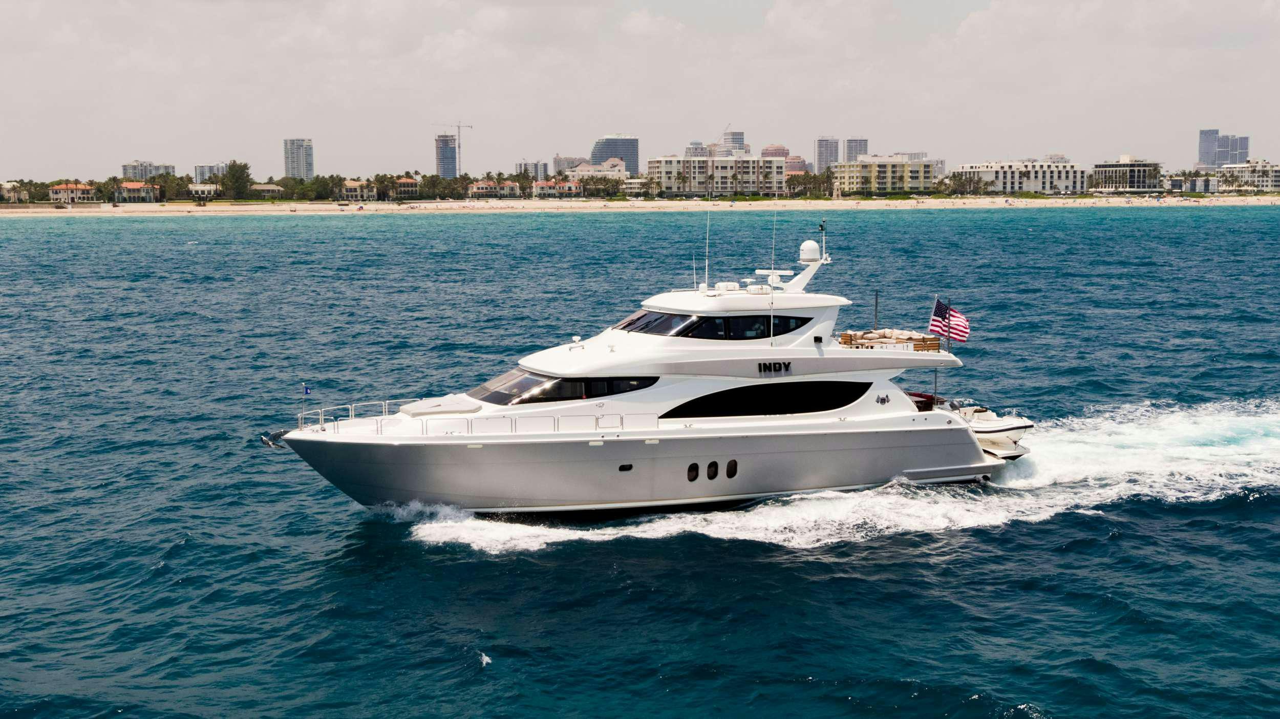 a white yacht on the water aboard INDY Yacht for Charter