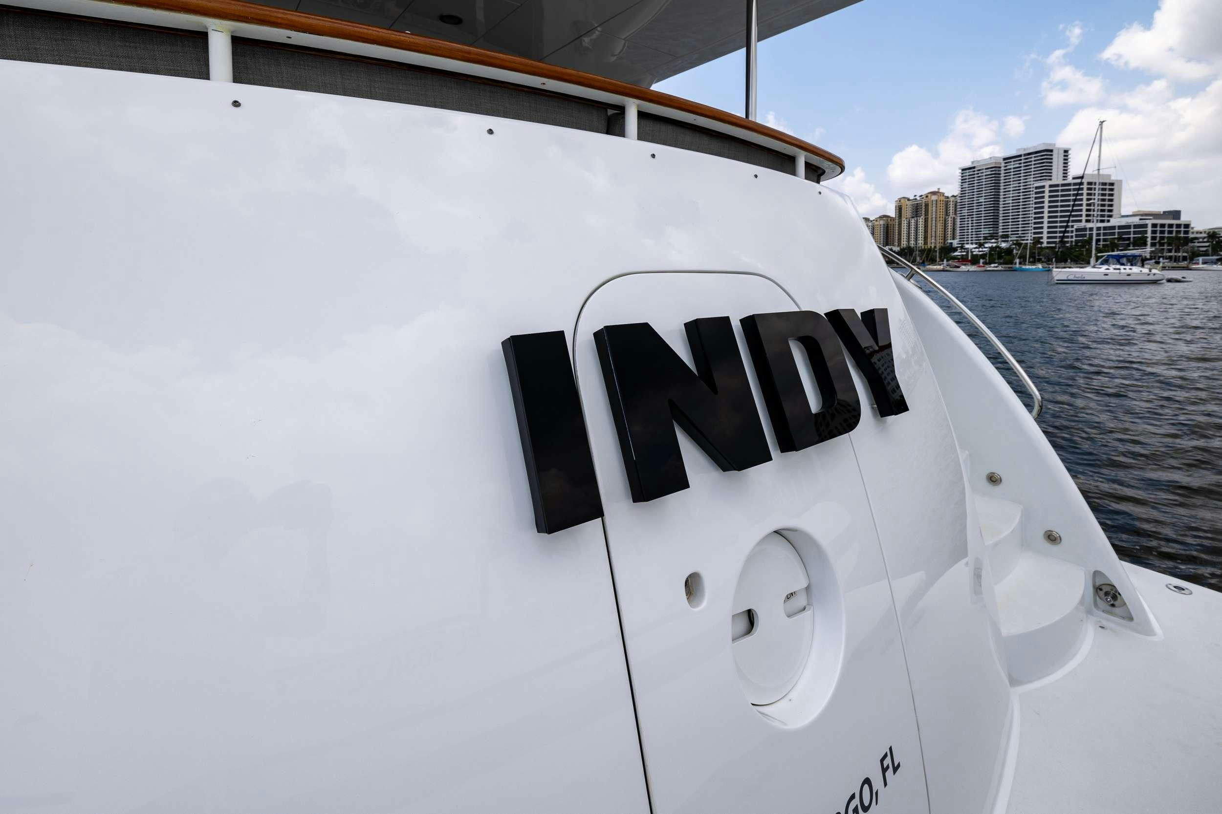 a white boat on the water aboard INDY Yacht for Charter
