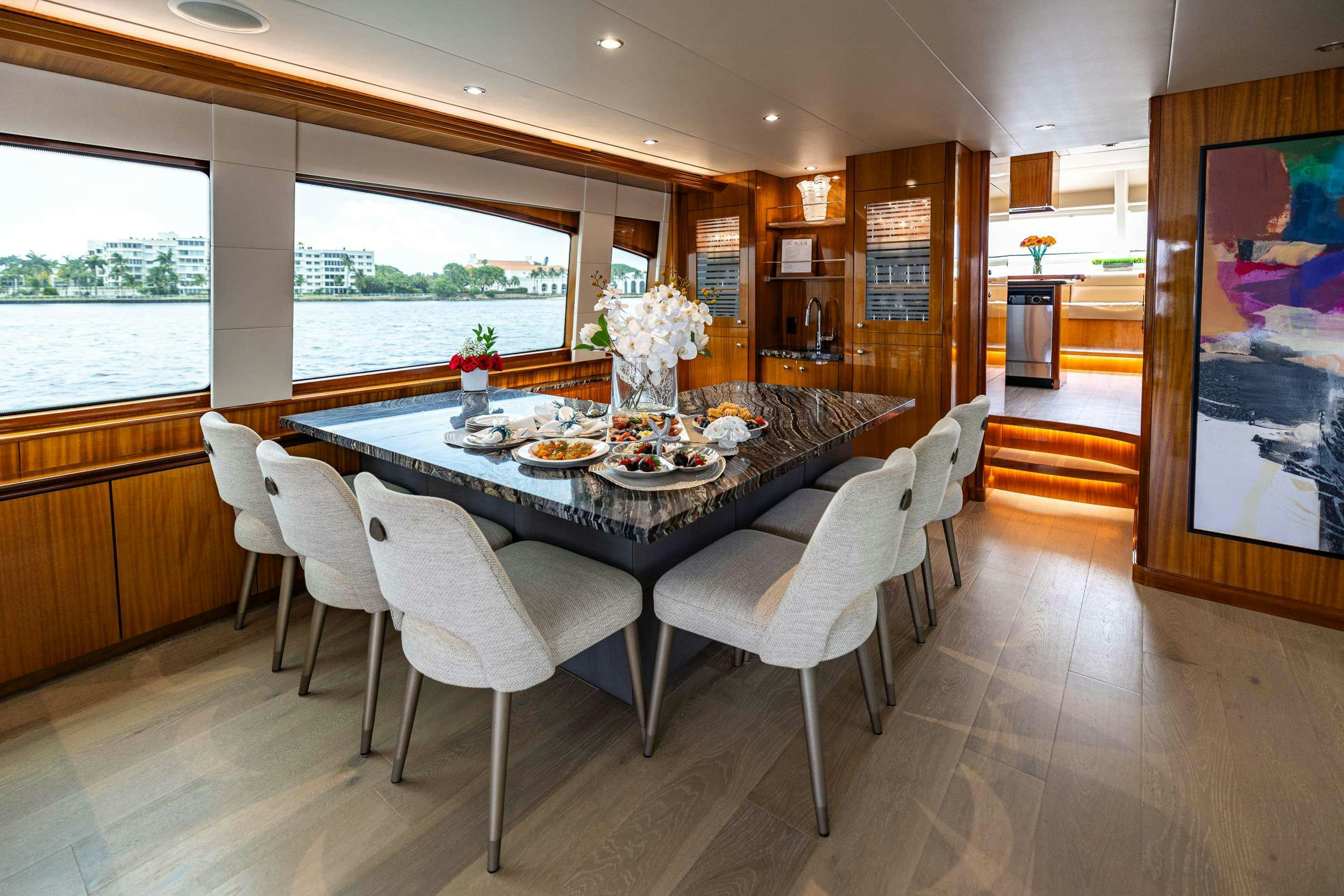 a dining table set for a meal aboard INDY Yacht for Charter