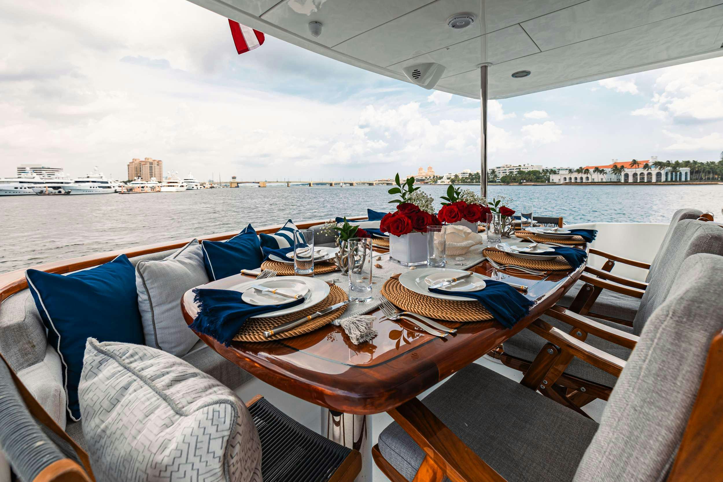 a table set for a dinner aboard INDY Yacht for Charter