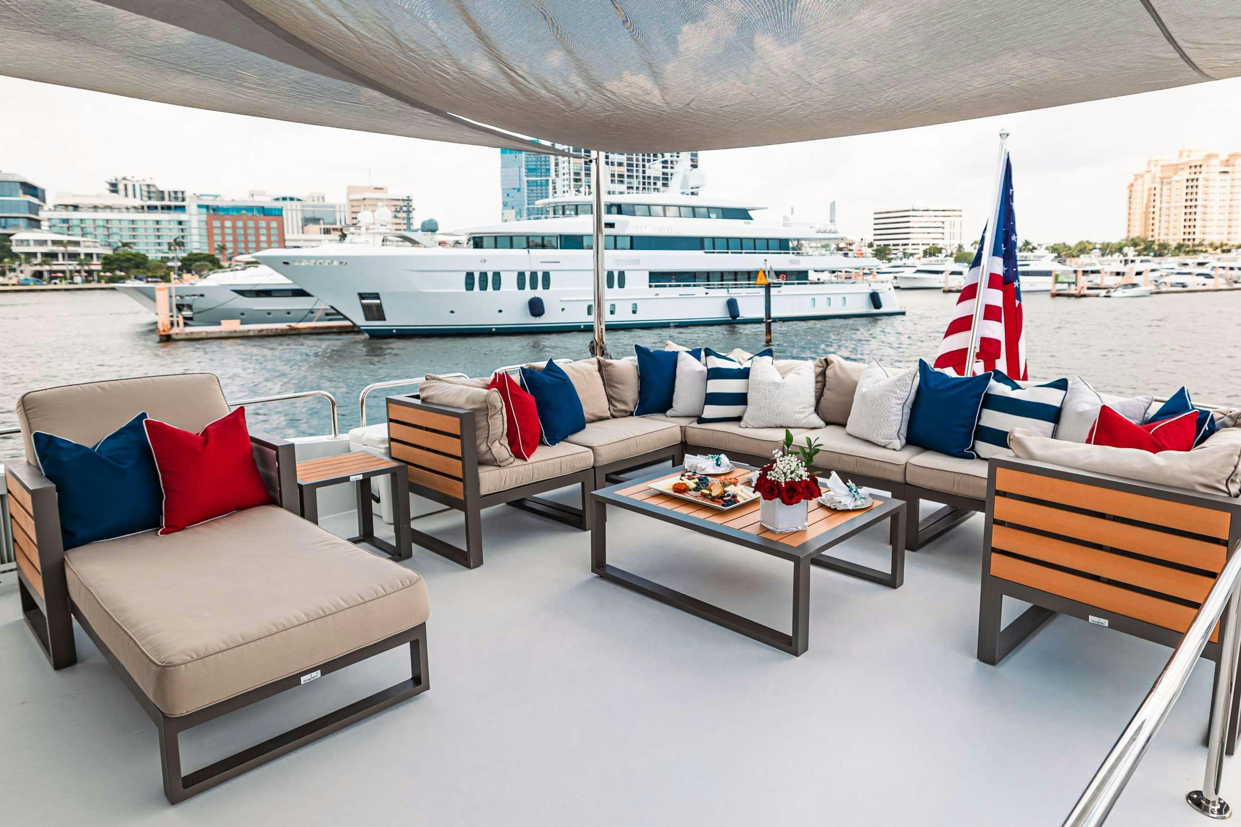 a living room with a large ship aboard INDY Yacht for Charter