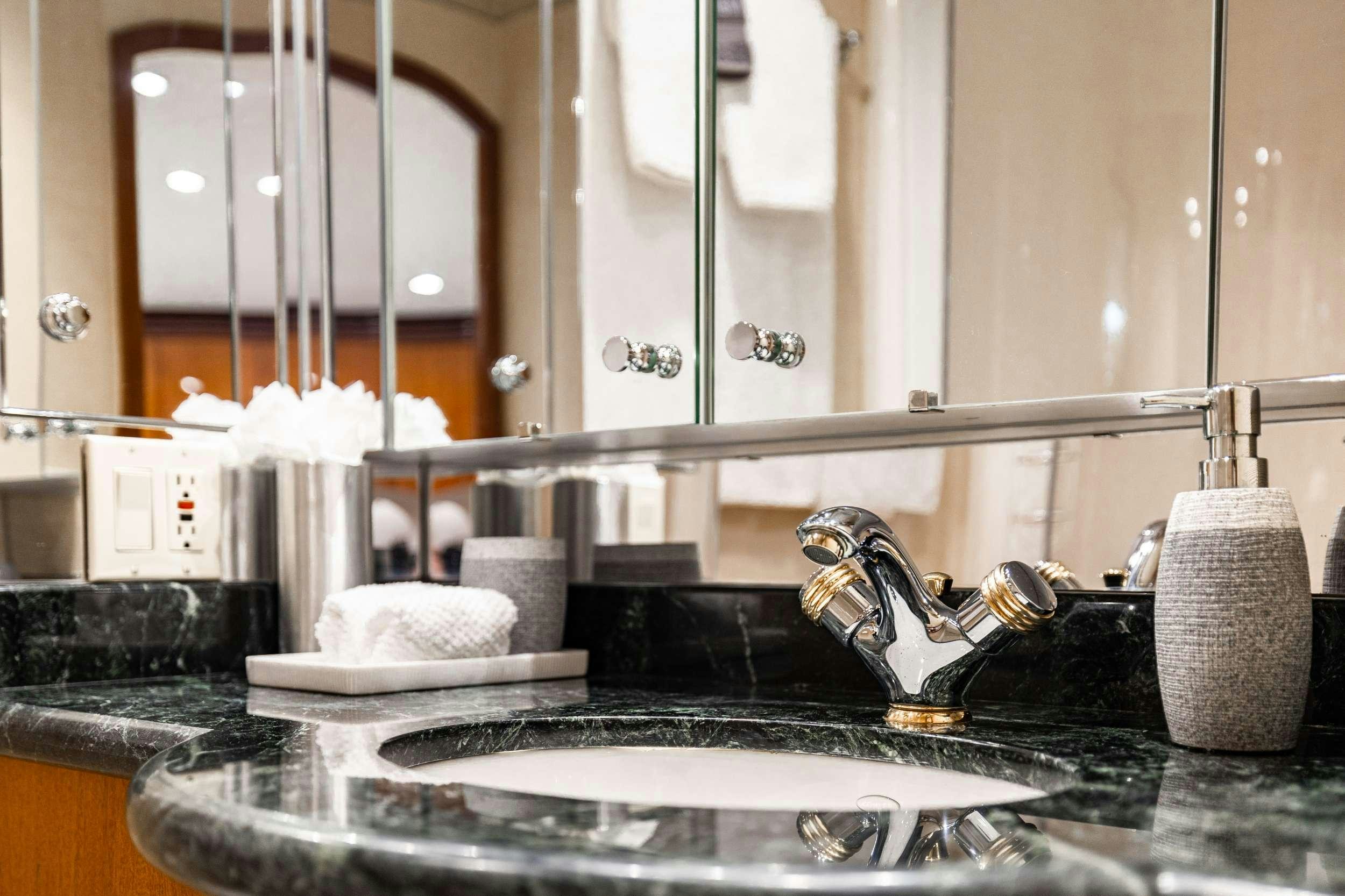 a kitchen sink with a faucet aboard INDY Yacht for Charter