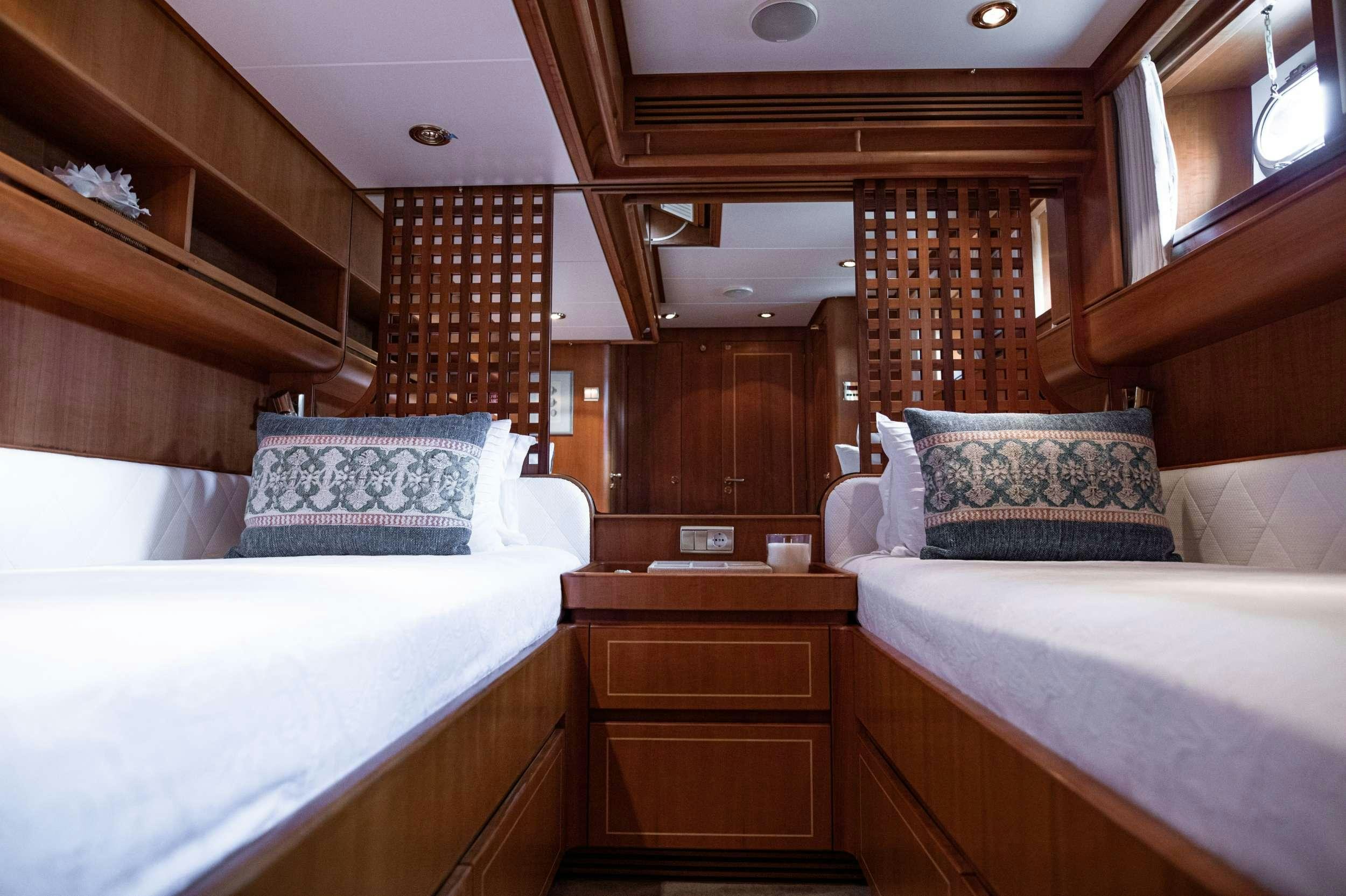 a room with two beds aboard SCARENA Yacht for Charter