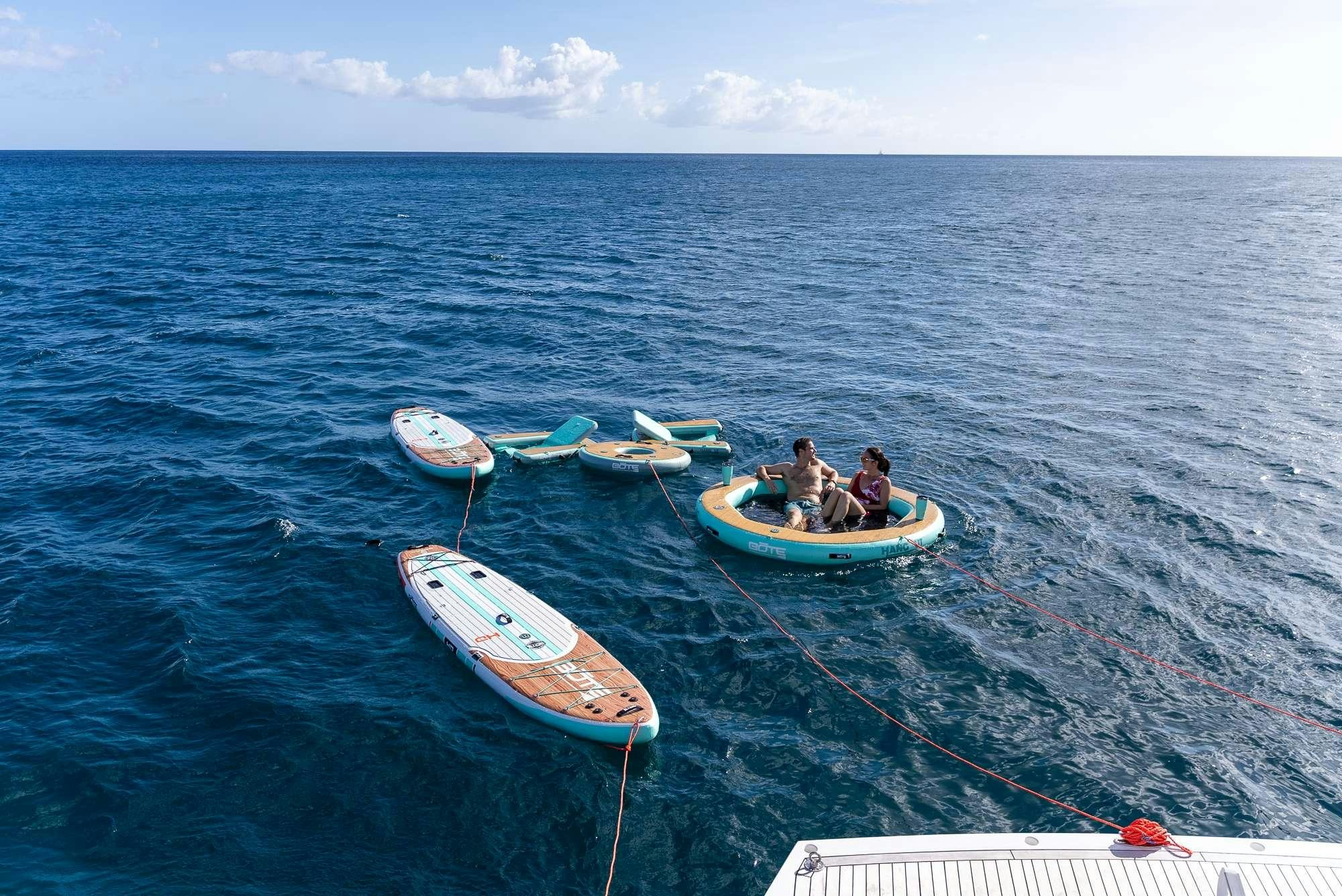 a group of people in boats in the water aboard ACCIDENTAL SUCCESS II Yacht for Charter