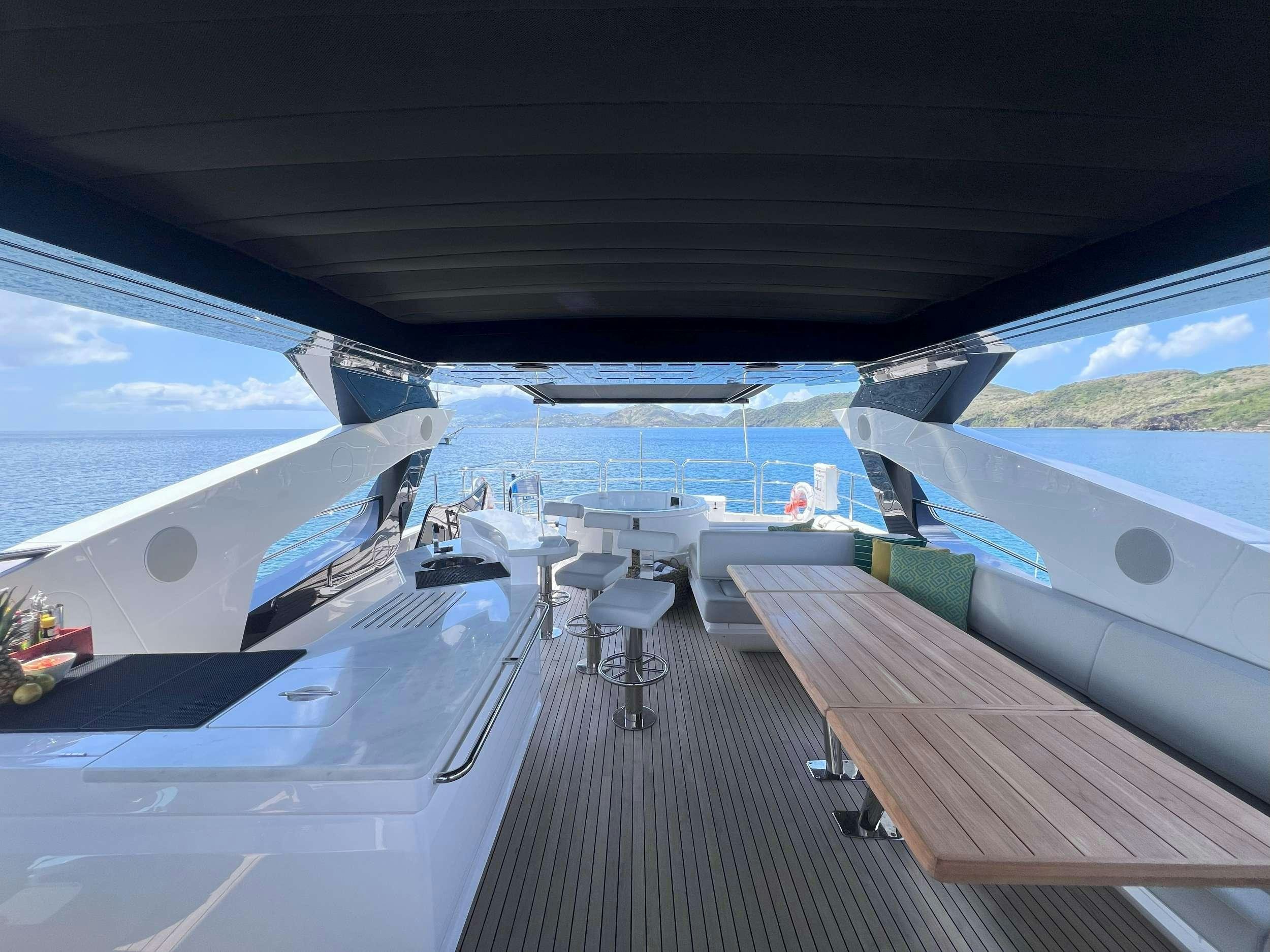 a deck with chairs and tables aboard ACCIDENTAL SUCCESS II Yacht for Charter