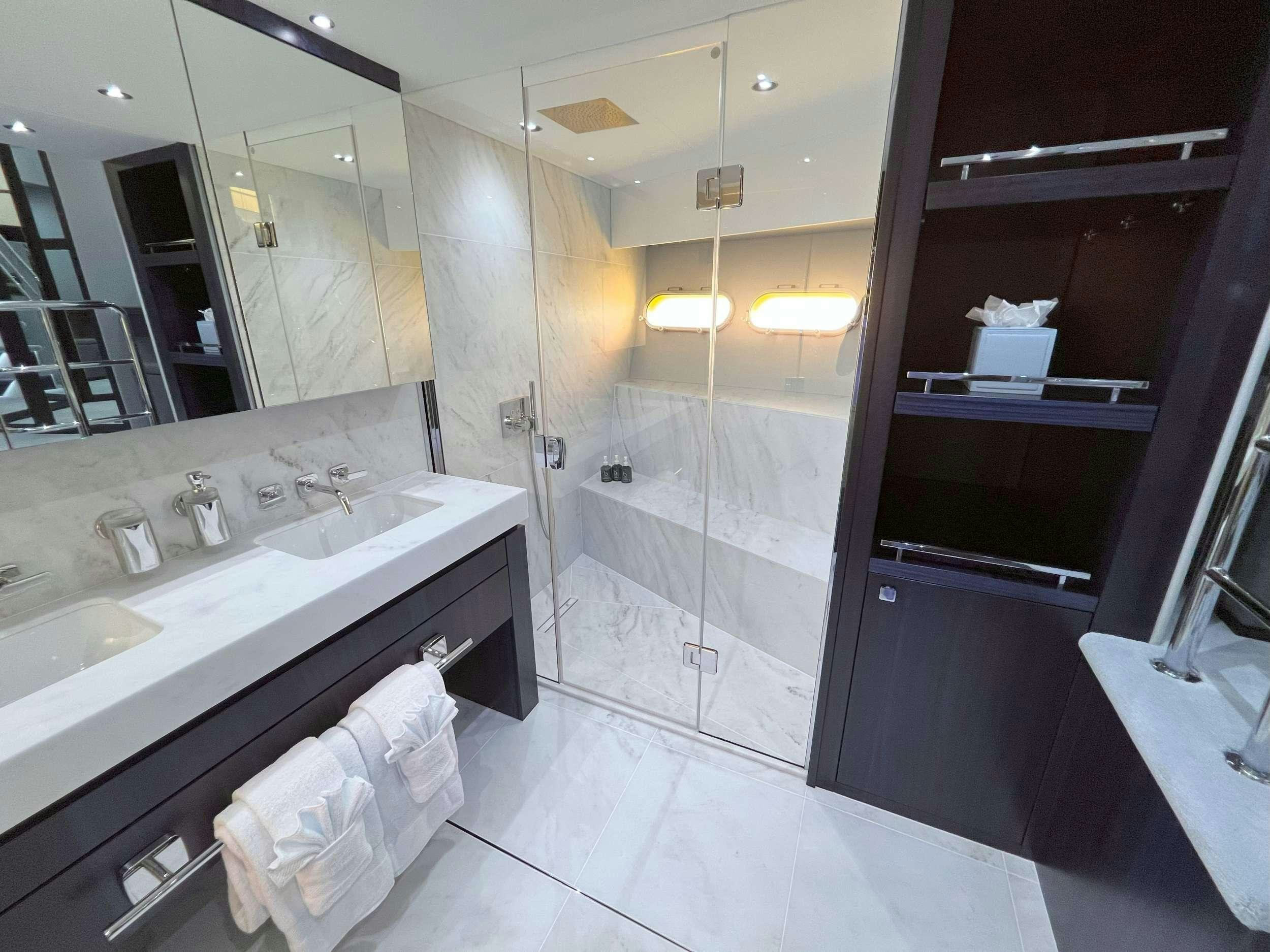a bathroom with a large mirror aboard ACCIDENTAL SUCCESS II Yacht for Charter