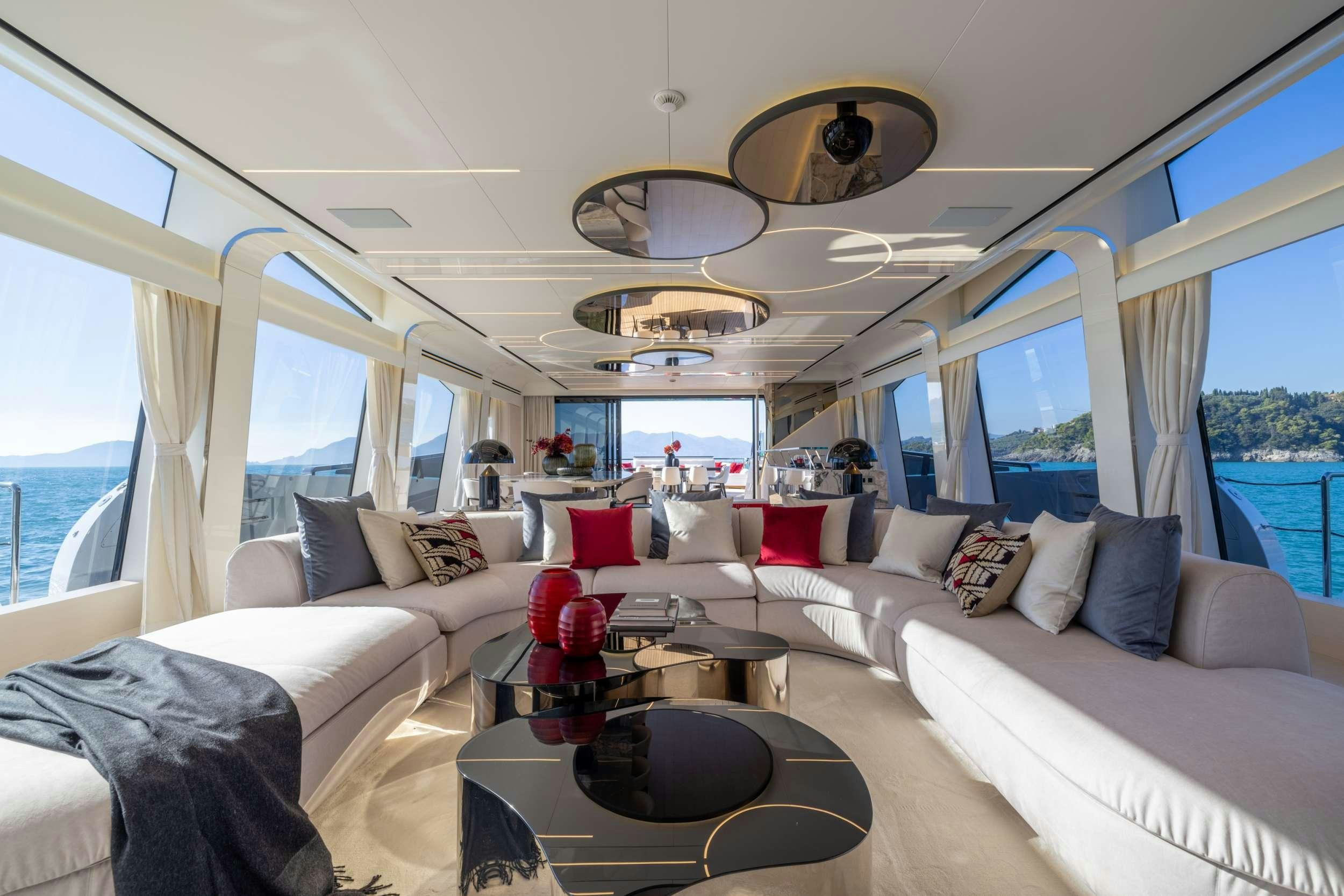 a living room with a large window aboard N1 Yacht for Charter