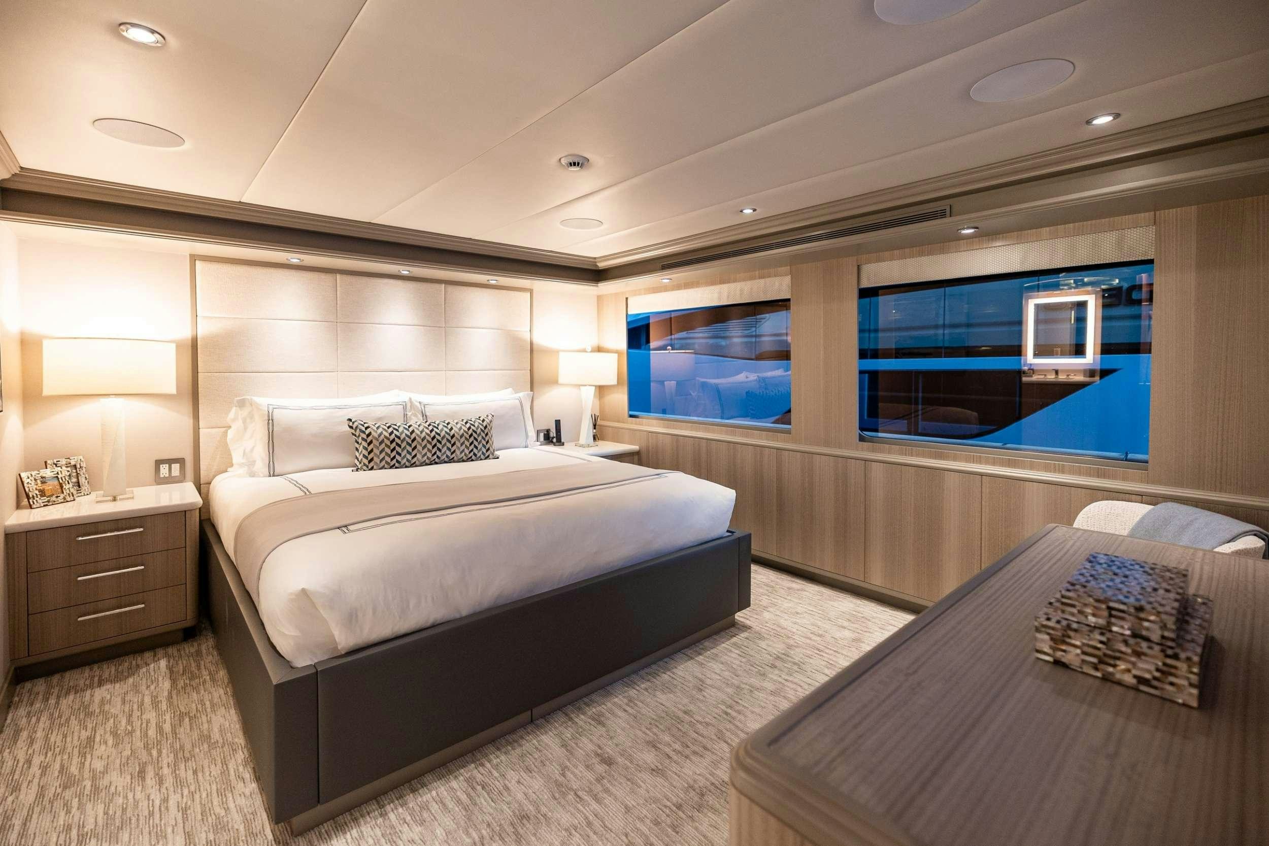a bedroom with a large bed aboard NO BAD IDEAS Yacht for Charter
