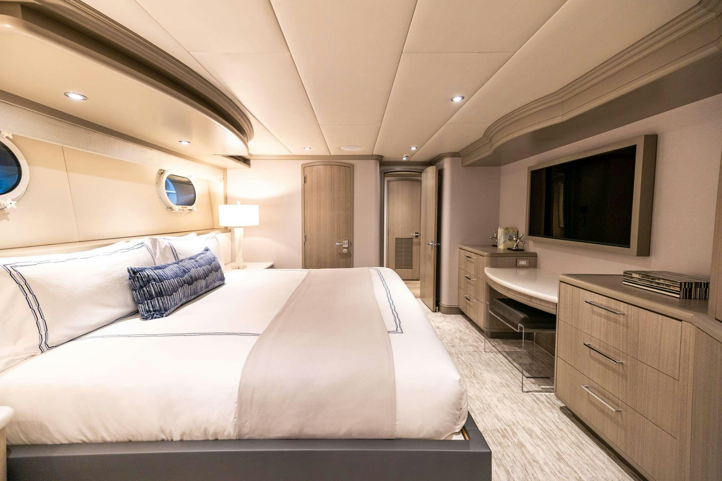 a large bedroom with a large bed aboard NO BAD IDEAS Yacht for Charter