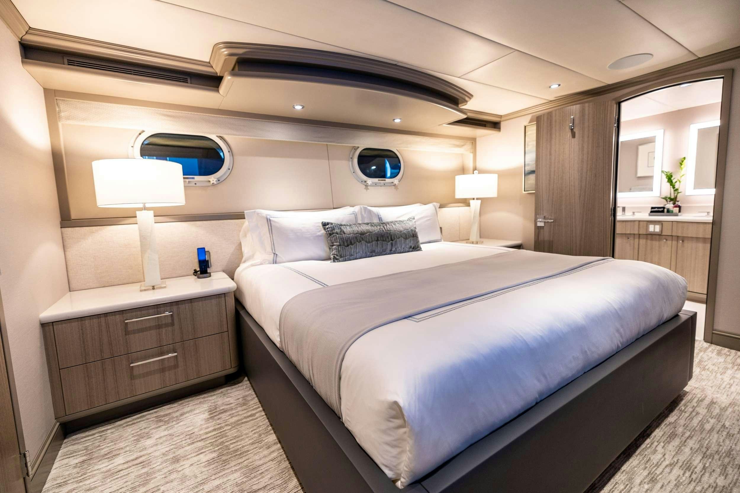 a large bed in a hotel room aboard NO BAD IDEAS Yacht for Charter