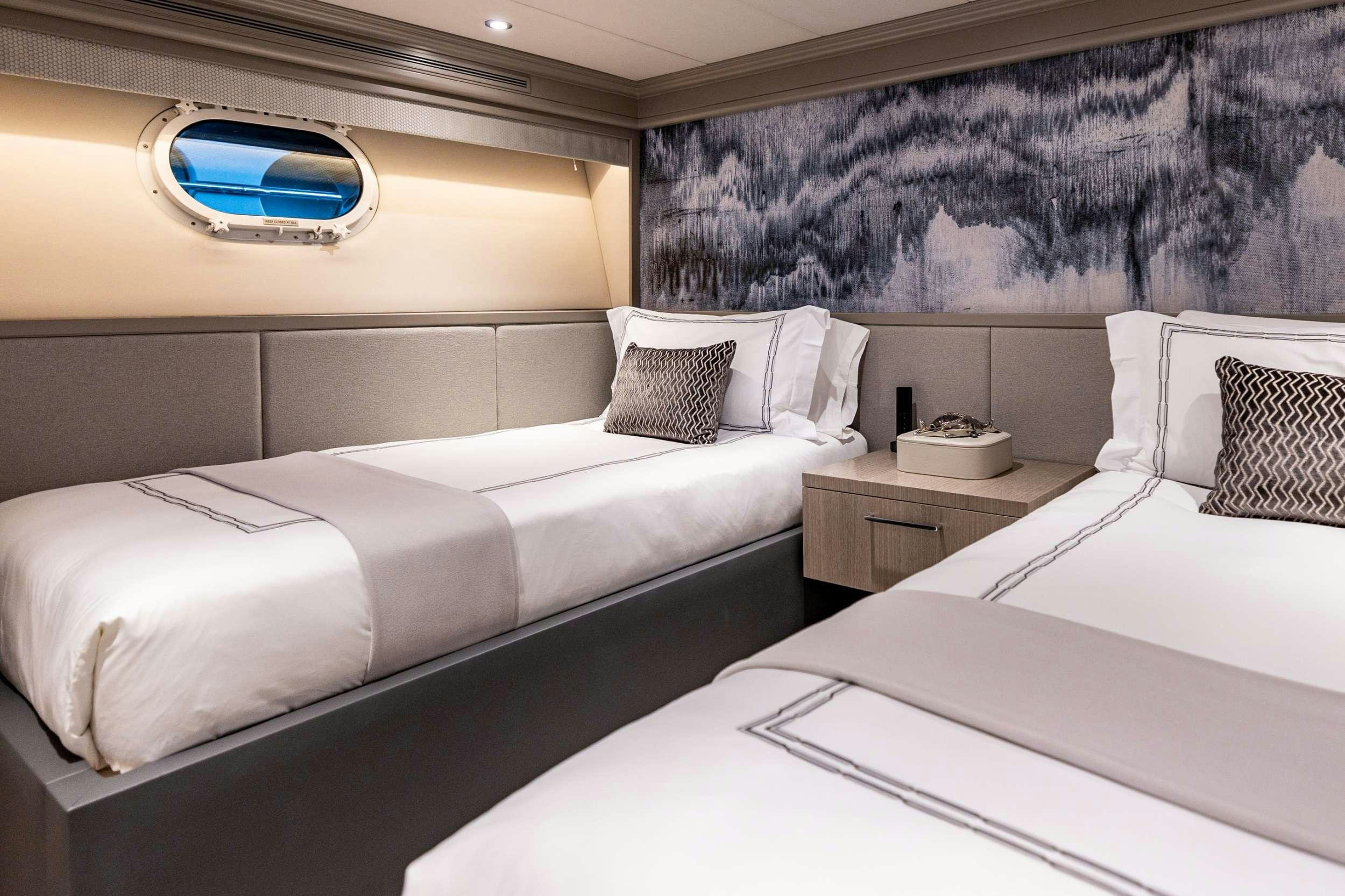 a room with two beds aboard NO BAD IDEAS Yacht for Charter