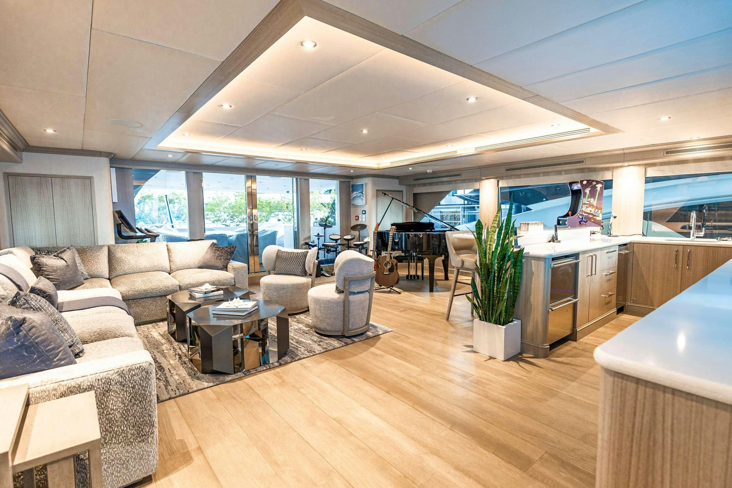a living room with a large window aboard NO BAD IDEAS Yacht for Charter