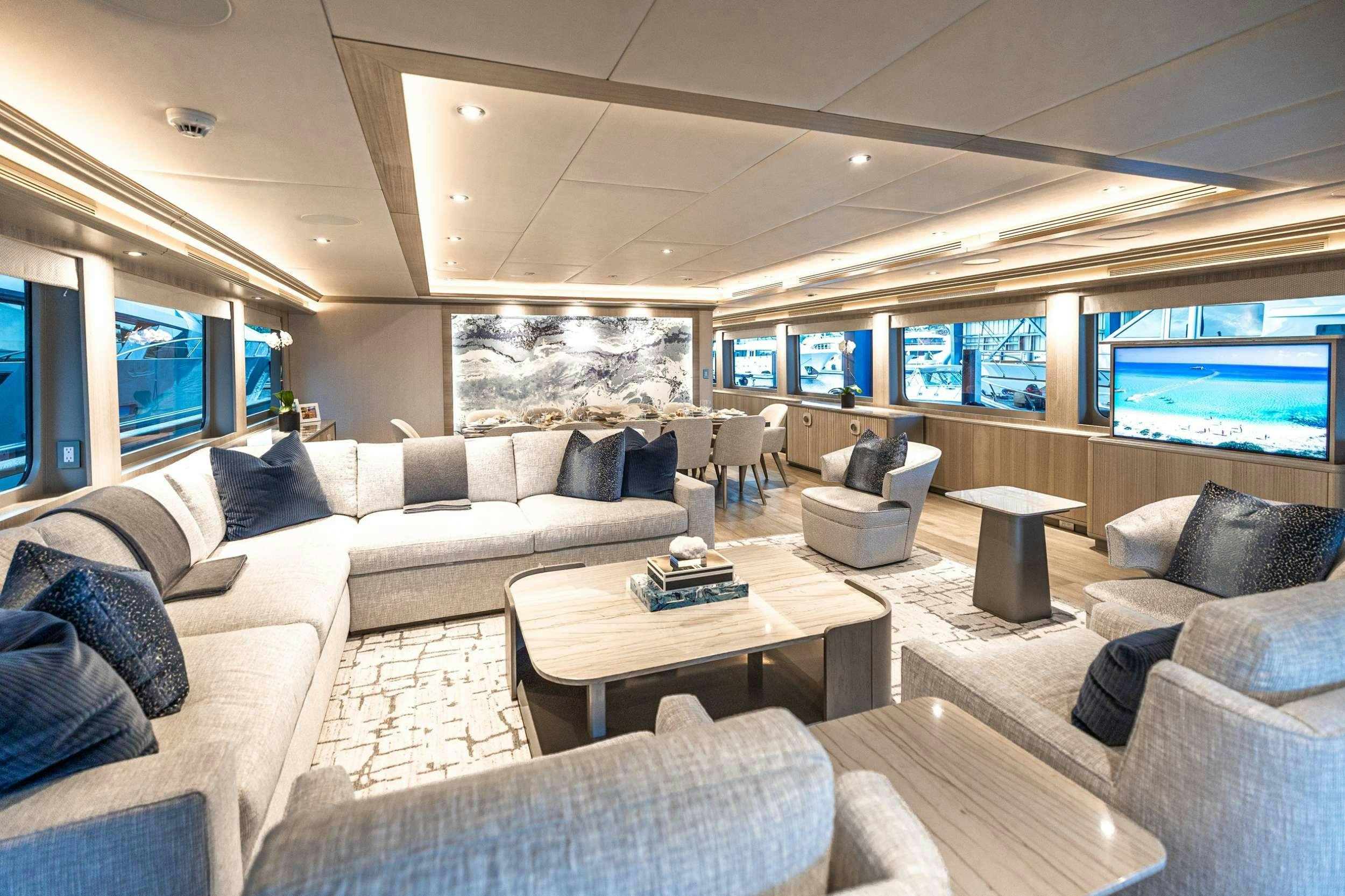 a living room with a large window aboard NO BAD IDEAS Yacht for Charter