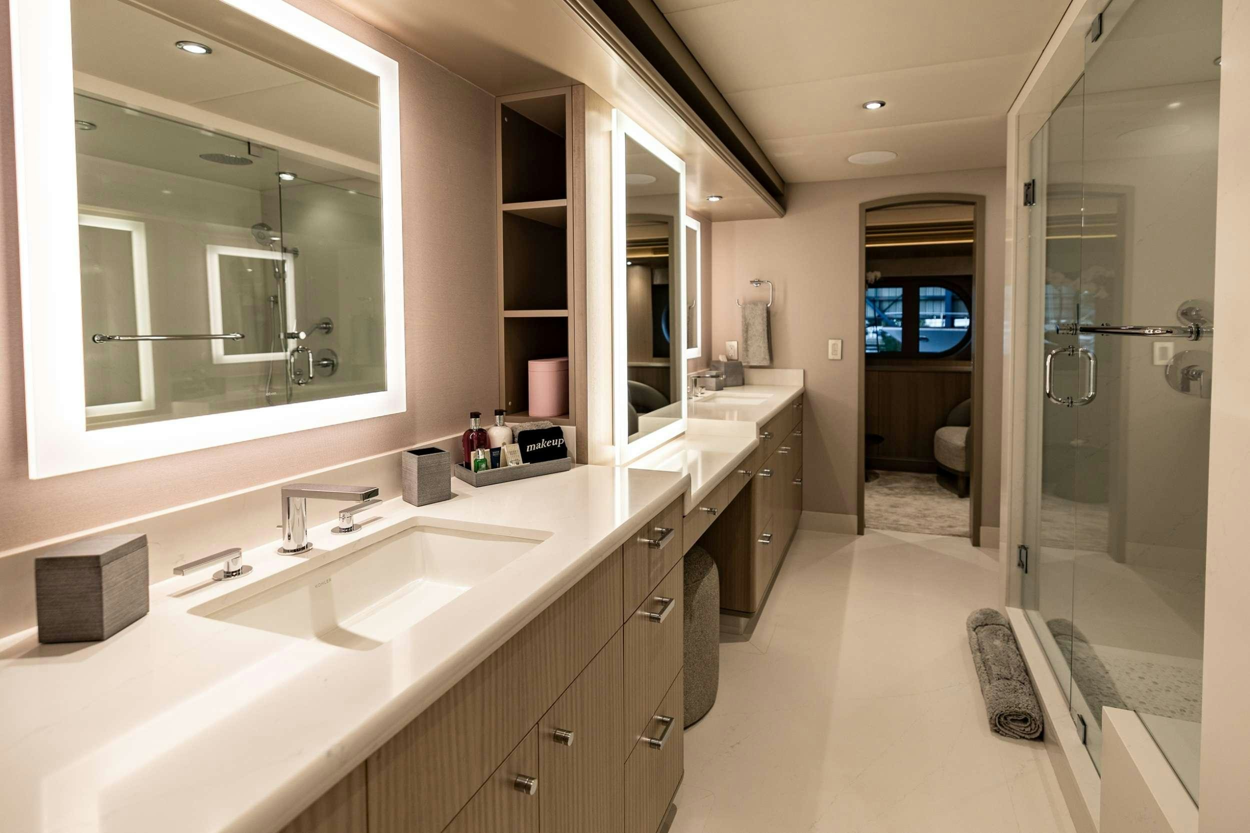 a bathroom with sinks and mirrors aboard NO BAD IDEAS Yacht for Charter