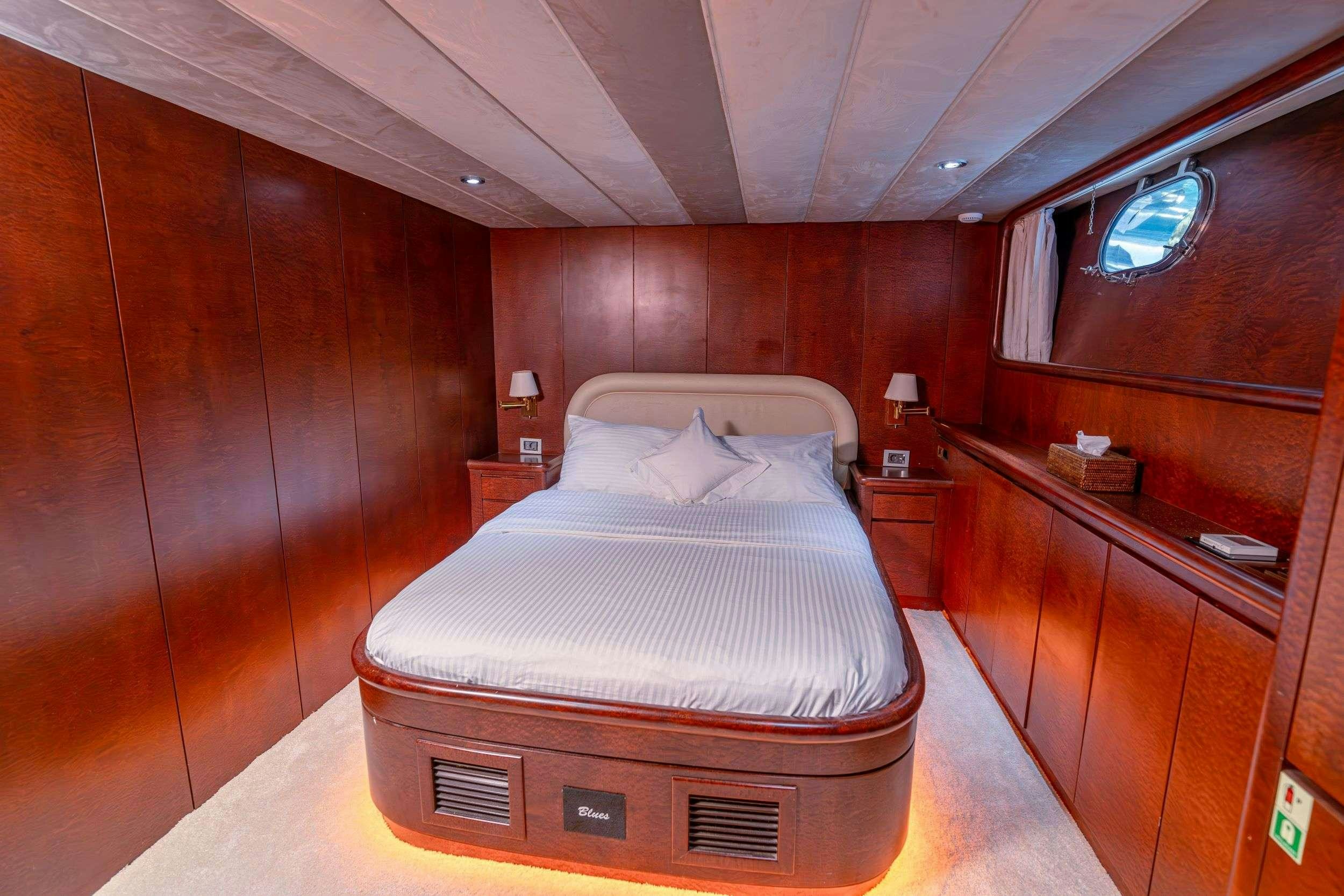 a bed in a room aboard BLUES Yacht for Charter