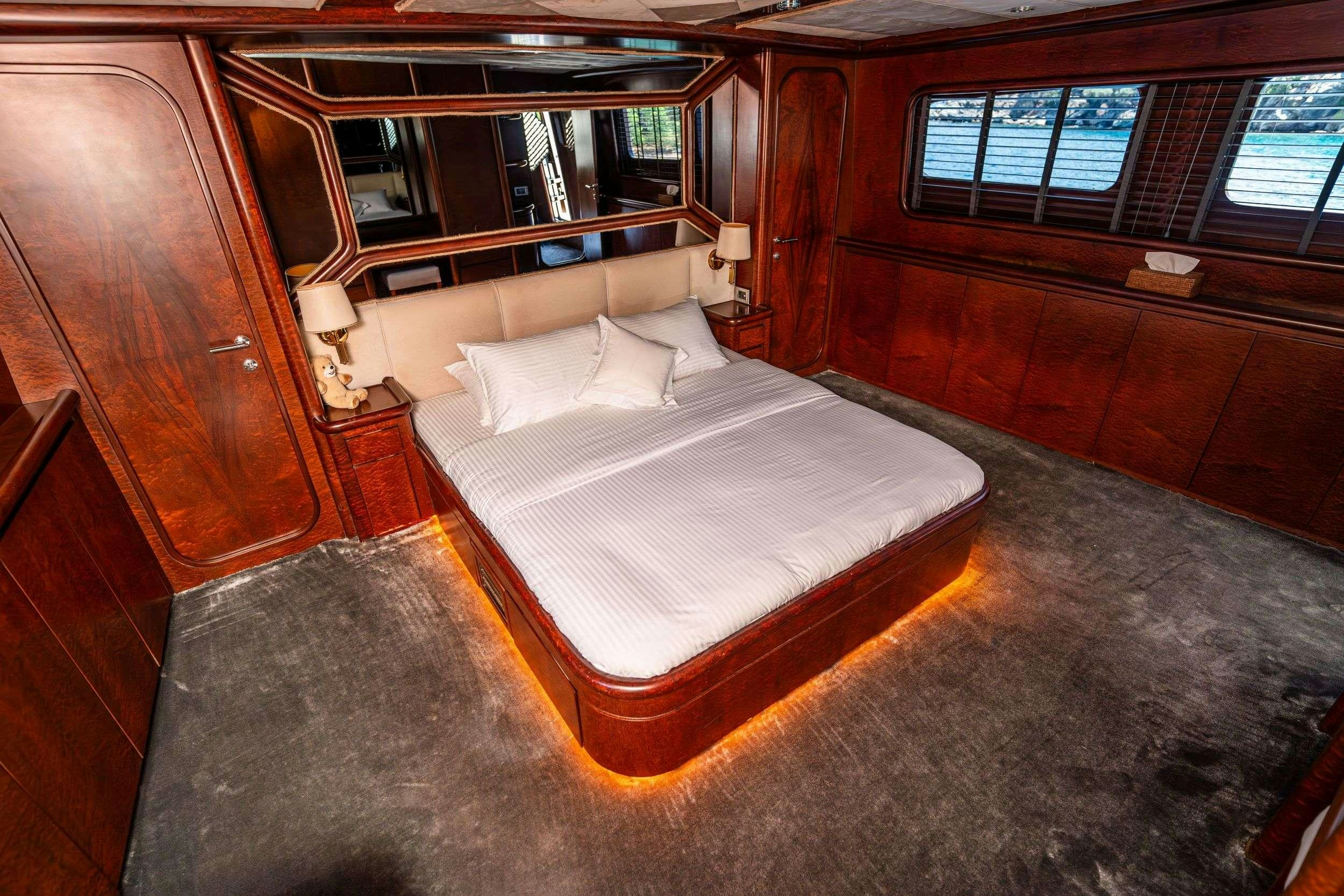 a bed in a room aboard BLUES Yacht for Charter