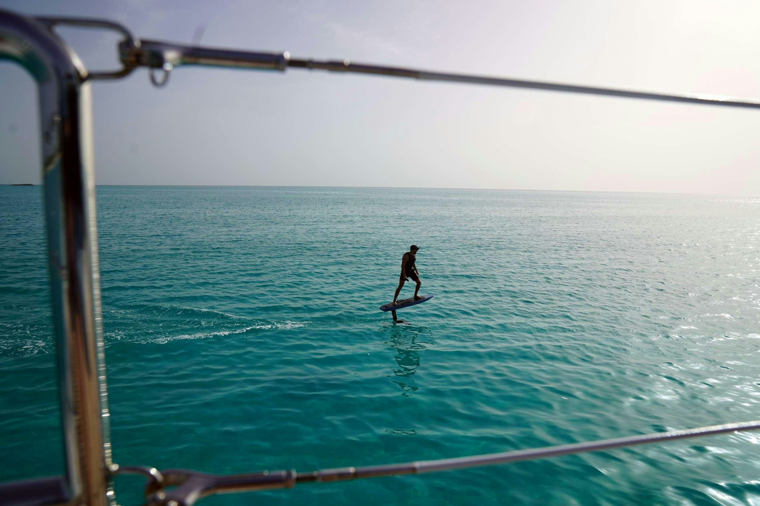a person surfing on the sea aboard MARIA THERESE Yacht for Charter