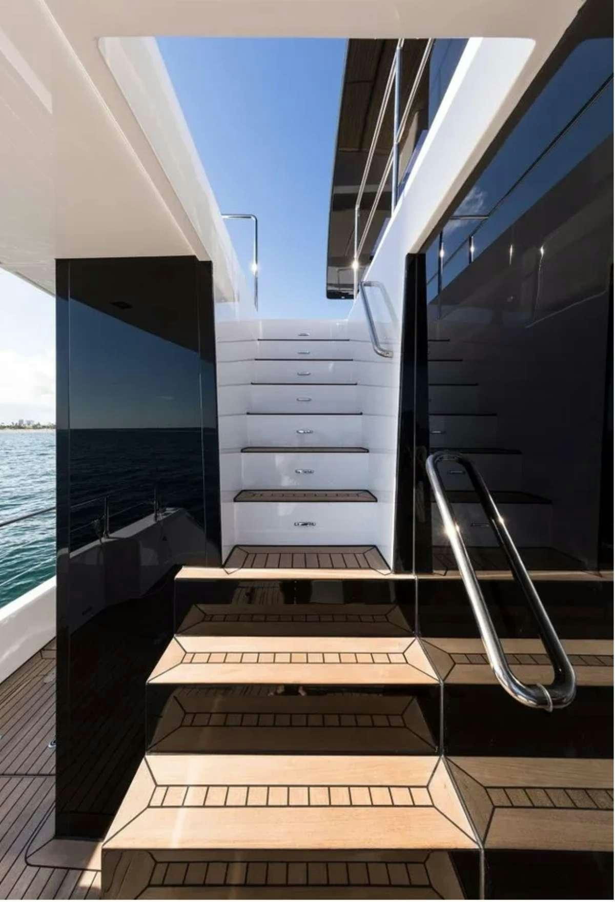 a staircase with glass doors aboard MARIA THERESE Yacht for Charter