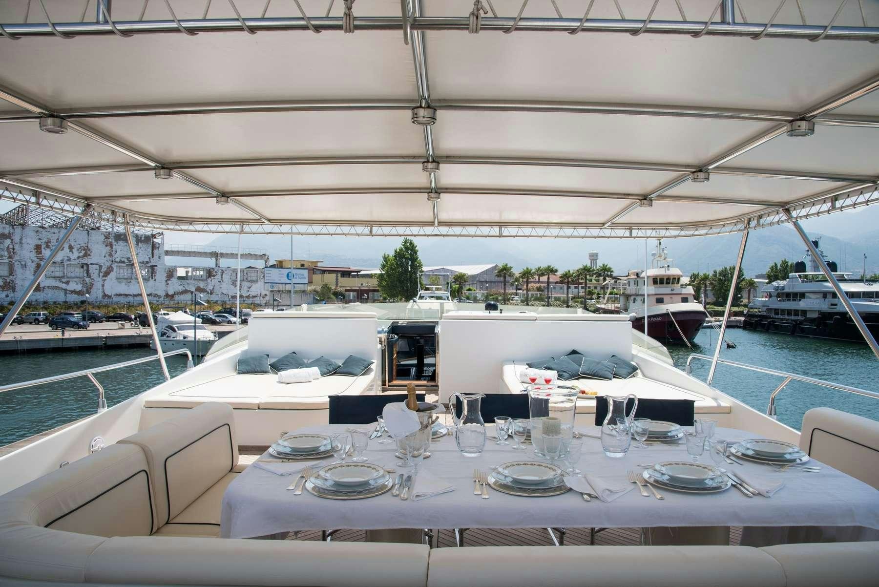 a table set for a dinner aboard ANNE MARIE Yacht for Charter