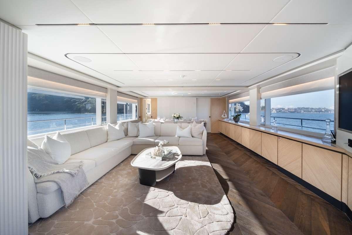 a living room with a large window aboard BLUESTONE 1 Yacht for Charter